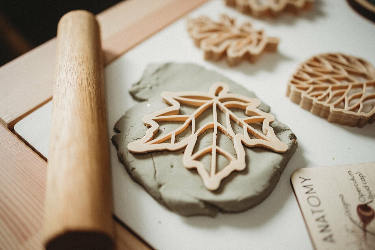 Three handcrafted leaf playdough cutters with natural textures, perfect for sensory play and nature crafts.