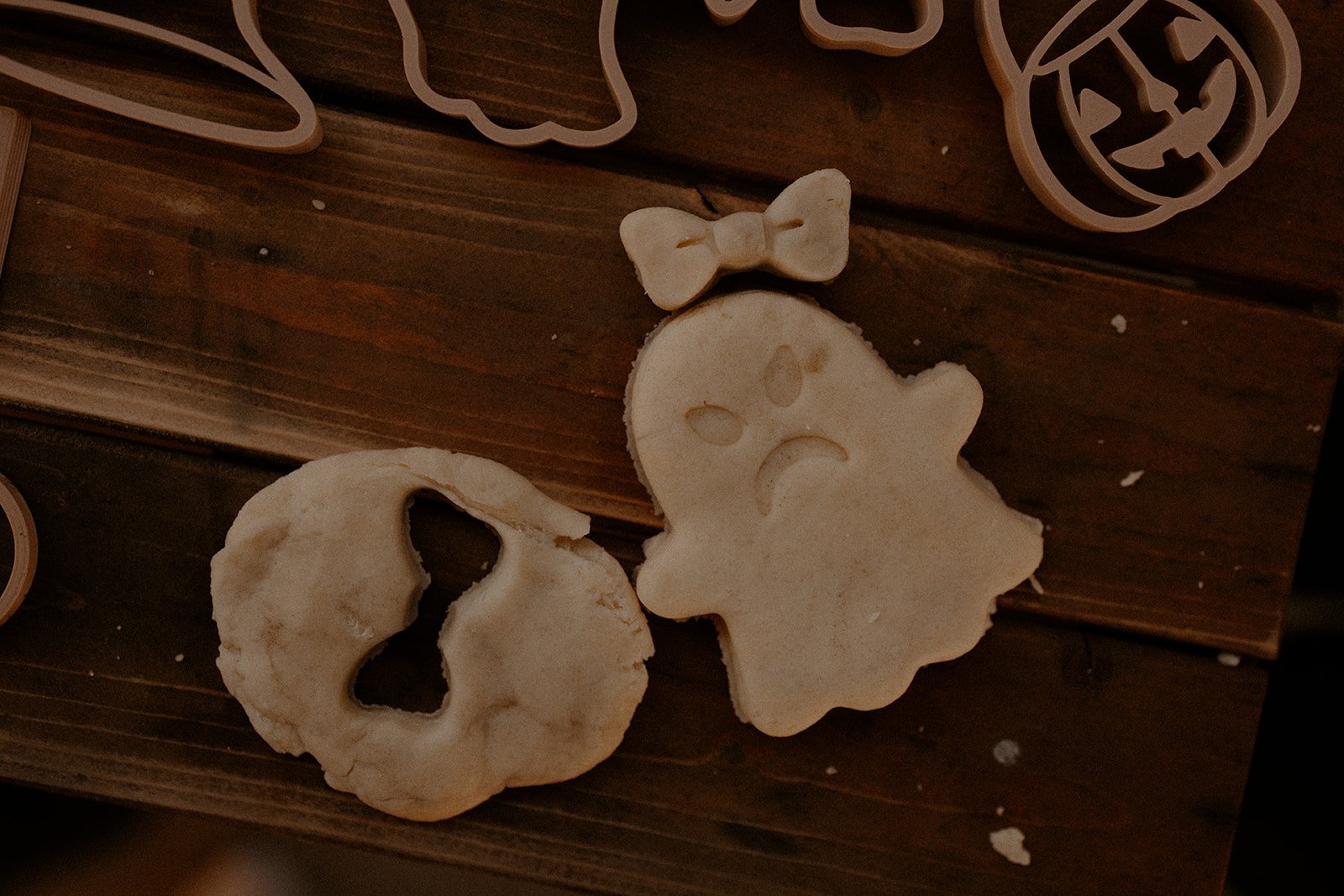 Pressed playdough ghosts with different facial expressions using stamp and cutter set