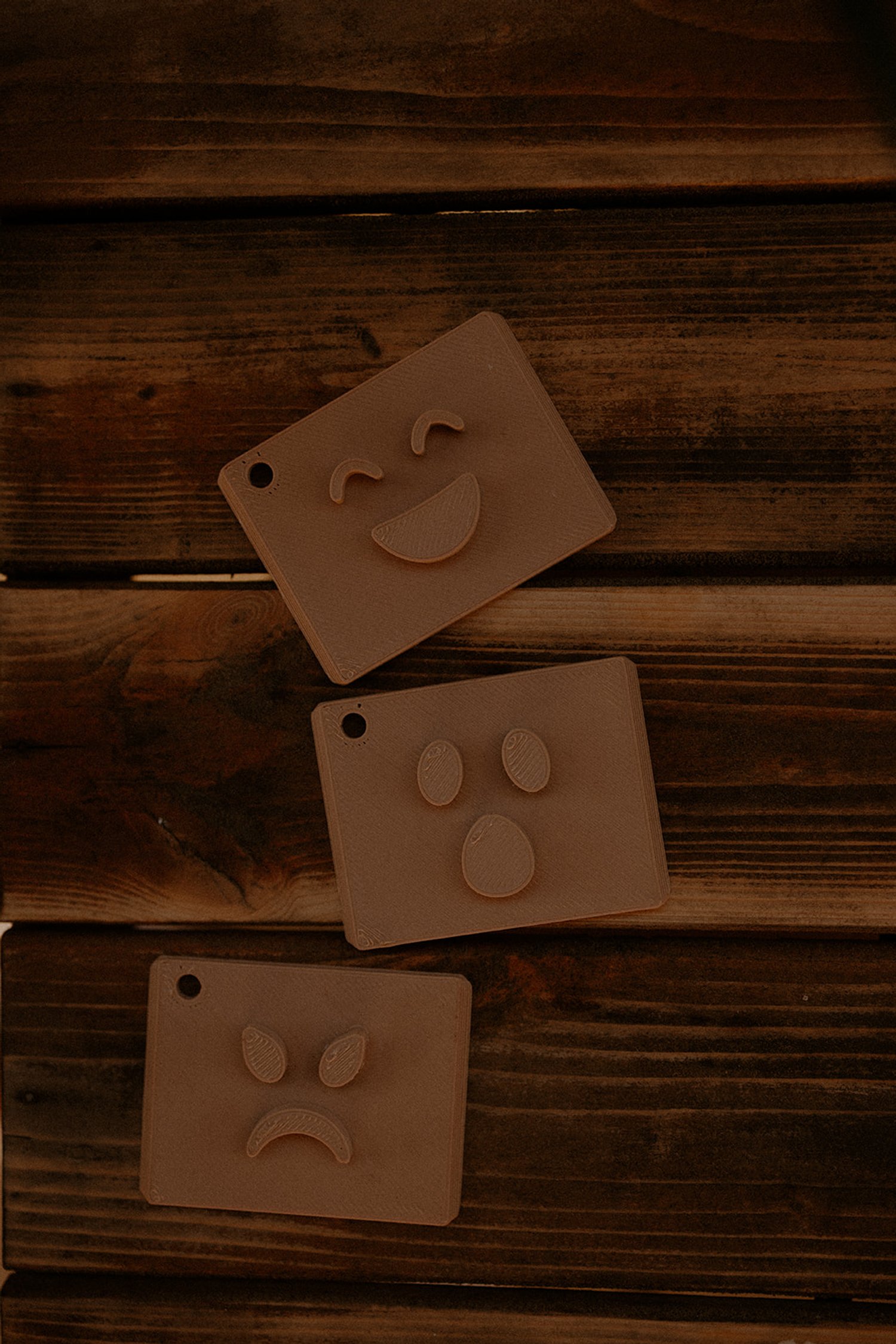 Smiling ghost face stamp and ghost footprint stamp on square wooden blocks