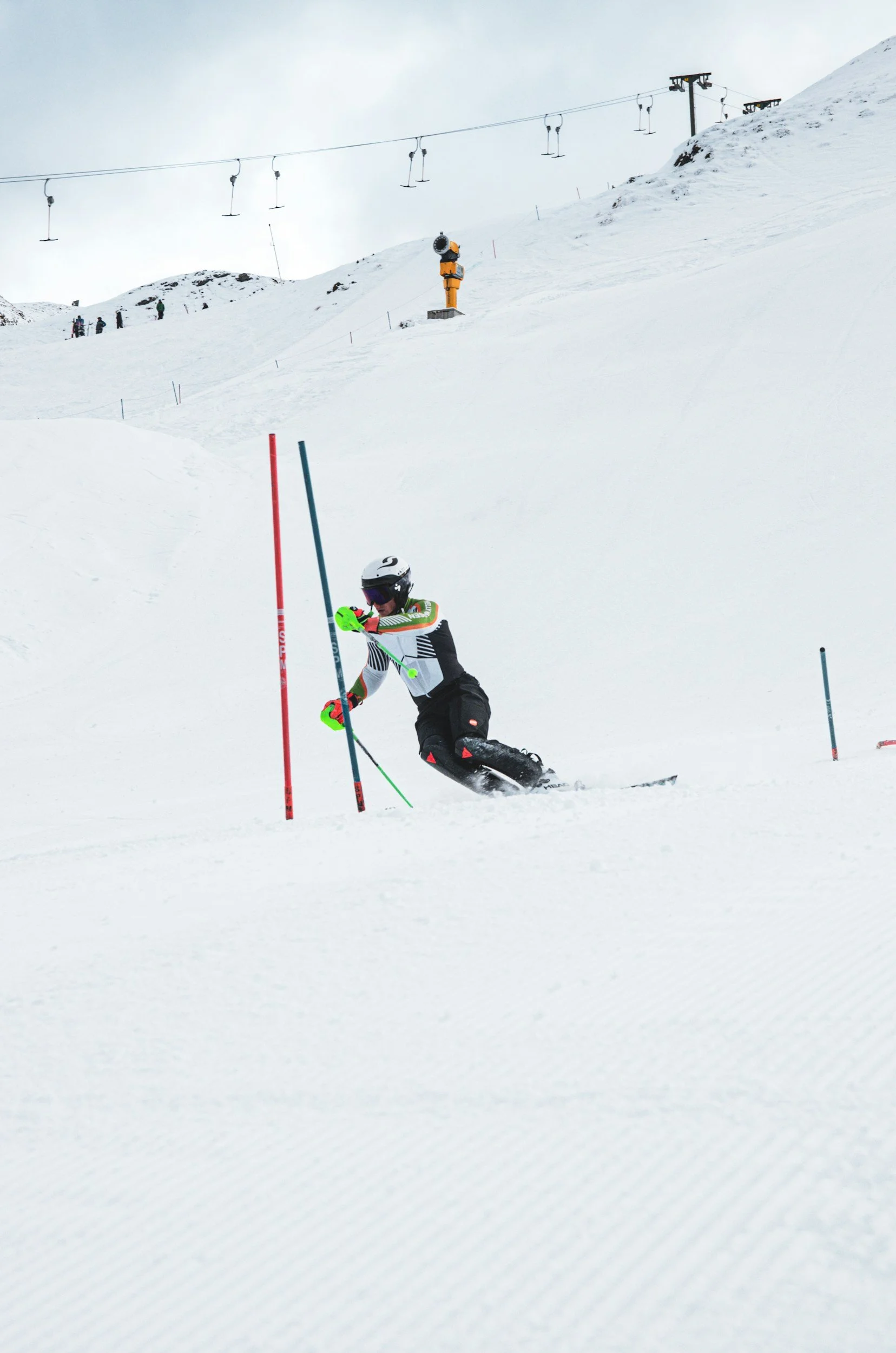 skiier racing through poles