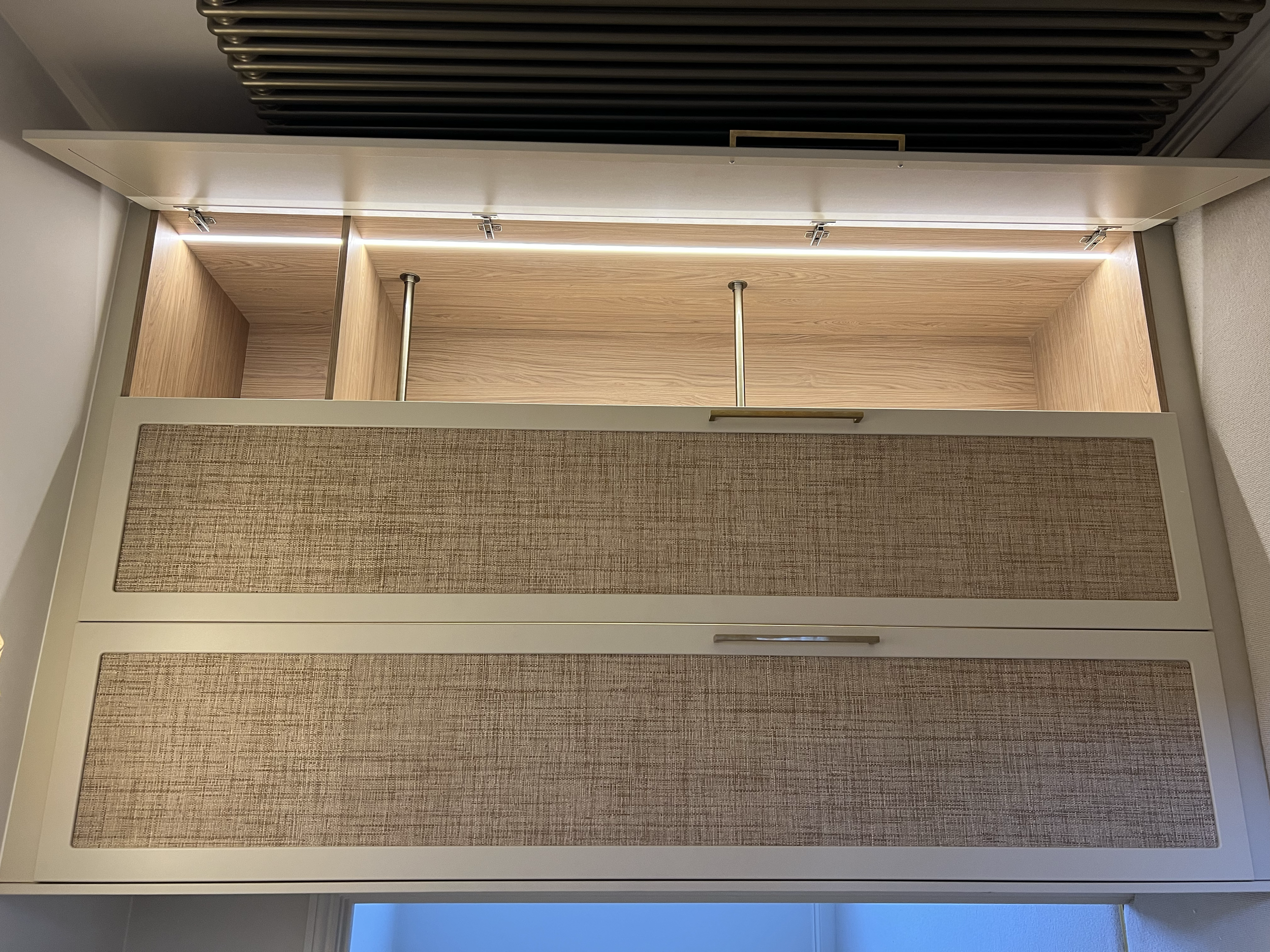 “Bespoke wardrobe design with custom shelving and hanging space in modern family home.”