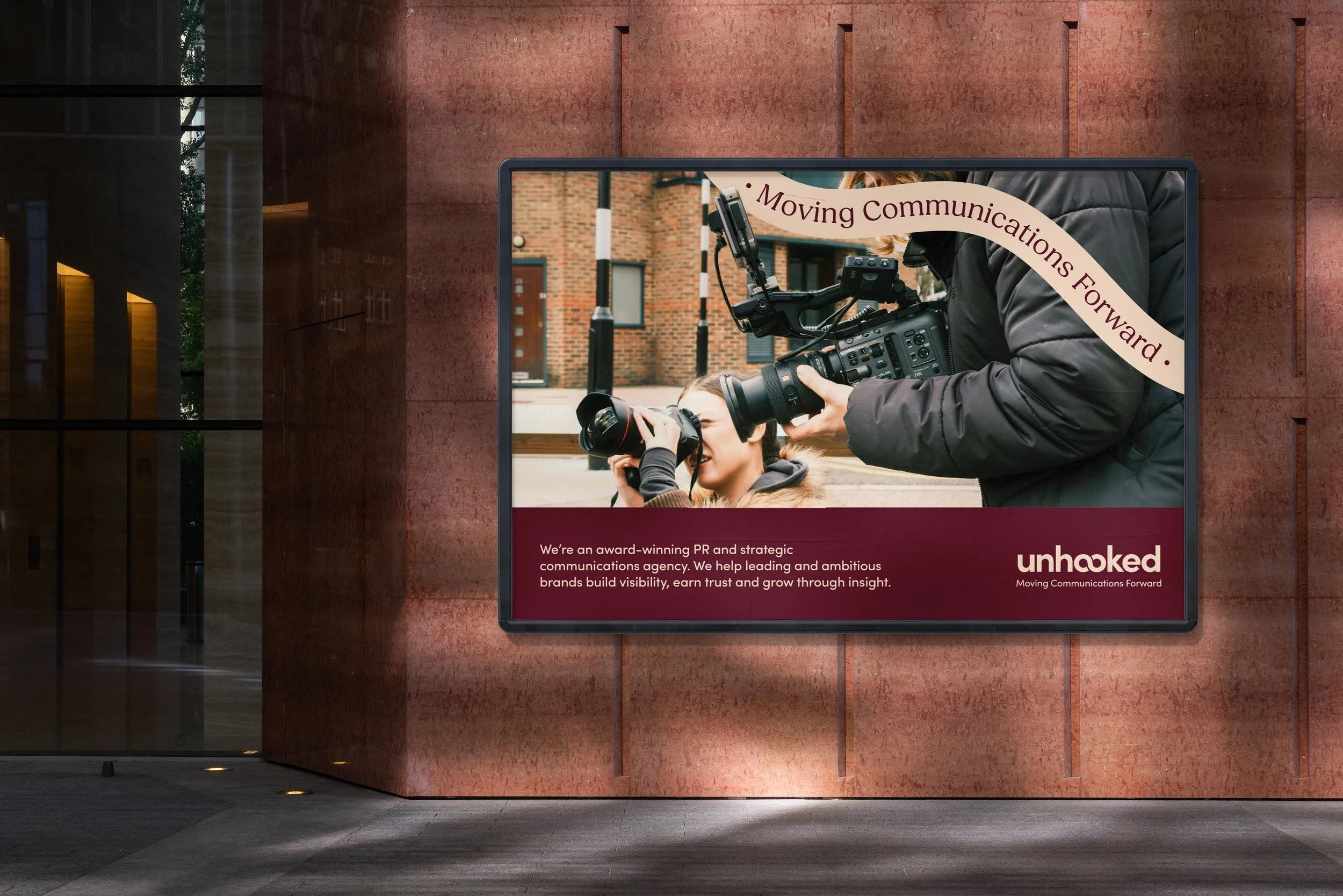 Unhooked_CS_Outdoor_Building_Mockup_2_Camera_Women.jpg