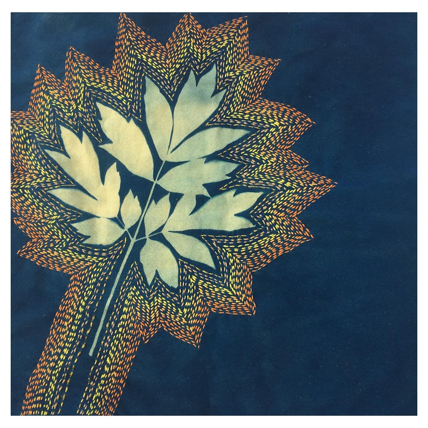 Finished #sashiko stitched #peony leaf #cyanotype on an #upcycled yellow linen napkin. I used a mix of threads: gold, silk and perle. Swipe to see the back side.