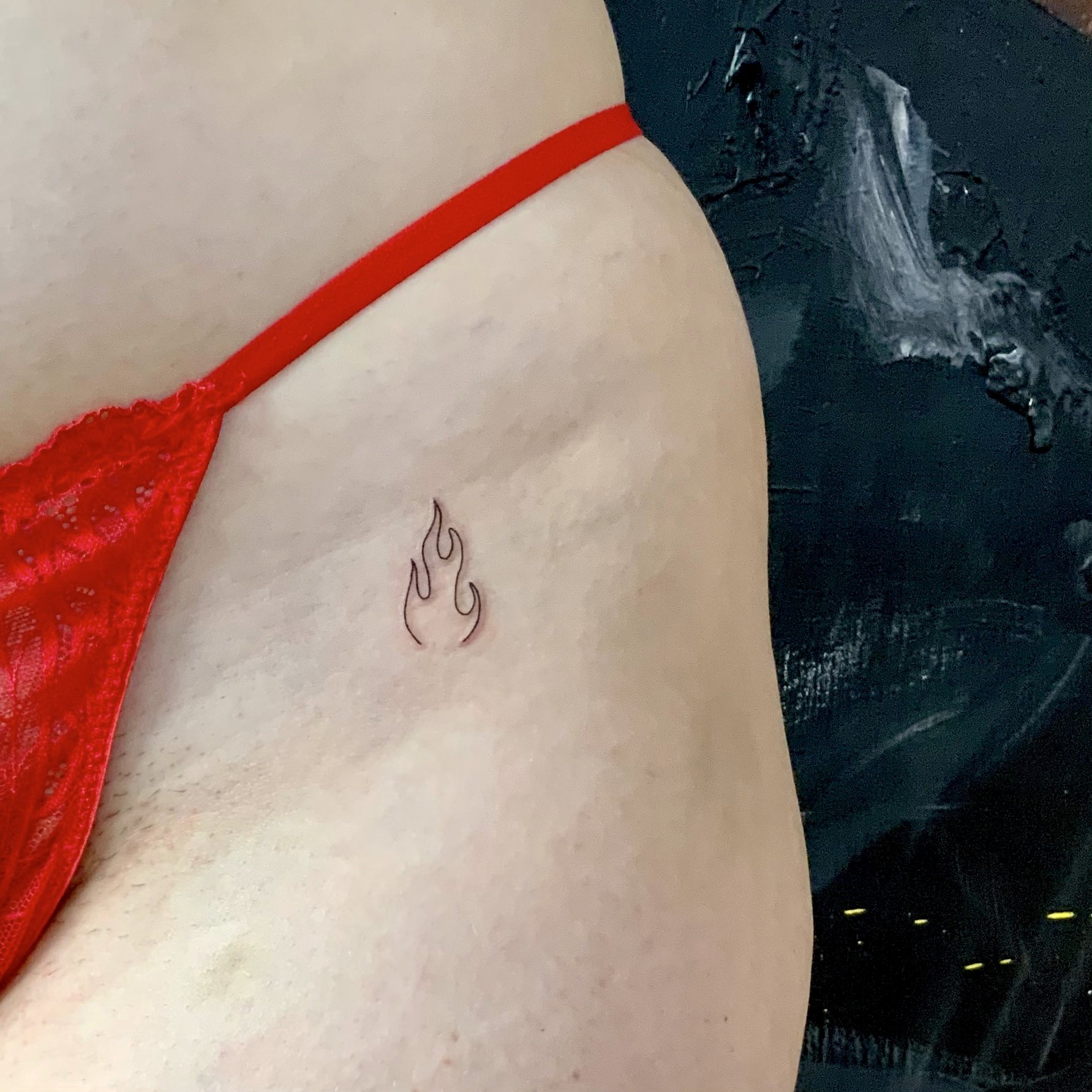 Flame mimi tattoo idea in fine lines tattoo style
