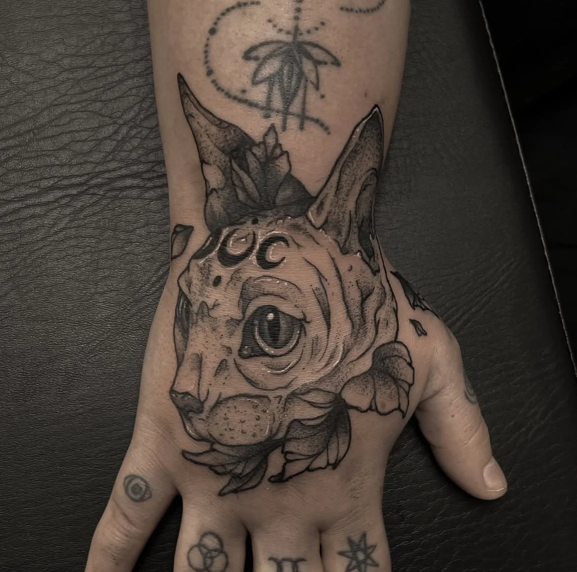 Cat on Hand Tattoo