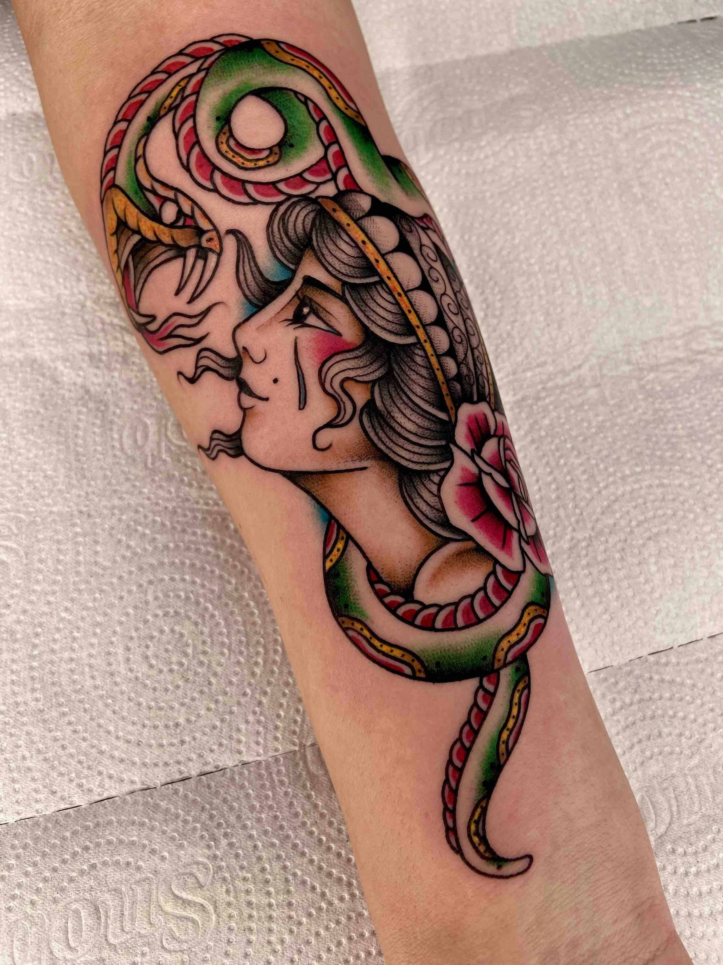 Snake-and-tattoo-girl-traditional-colourwork-tattoo.jpeg