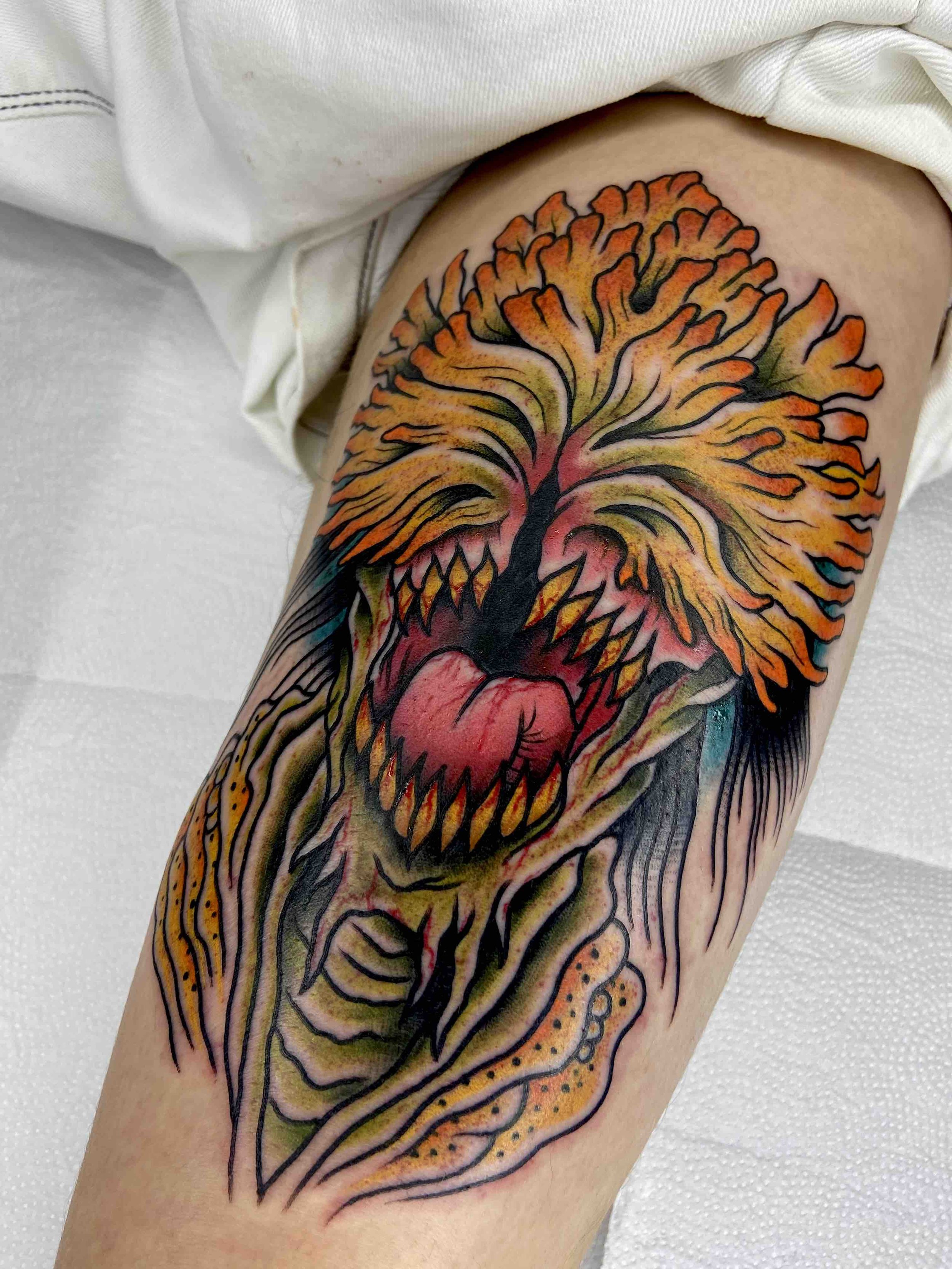 monster-arm-tattoo-traditional-colourwork-sharp-teeth-horror.jpeg