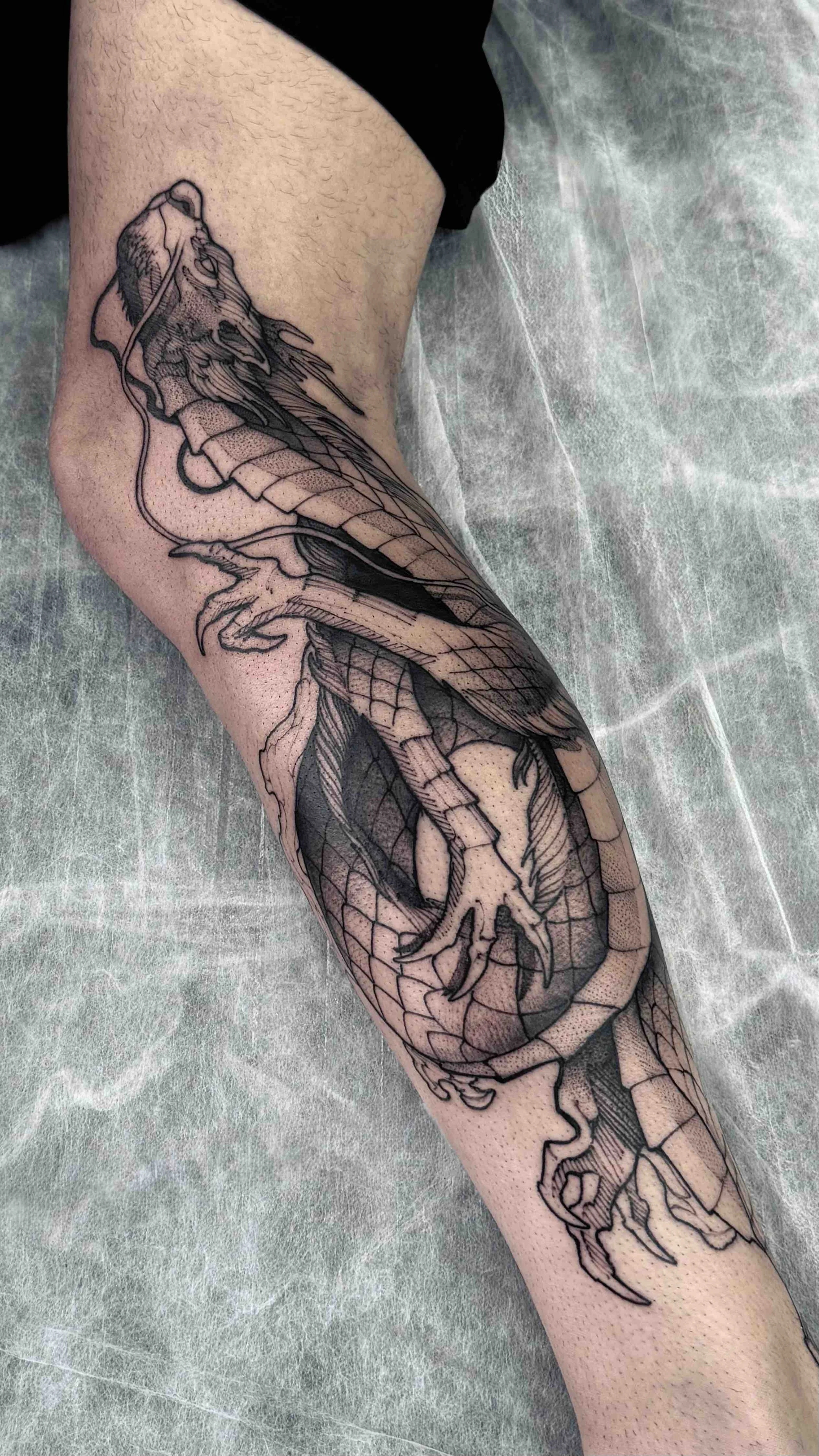 leg-piece-dragon-blackwork-tattoo.jpeg