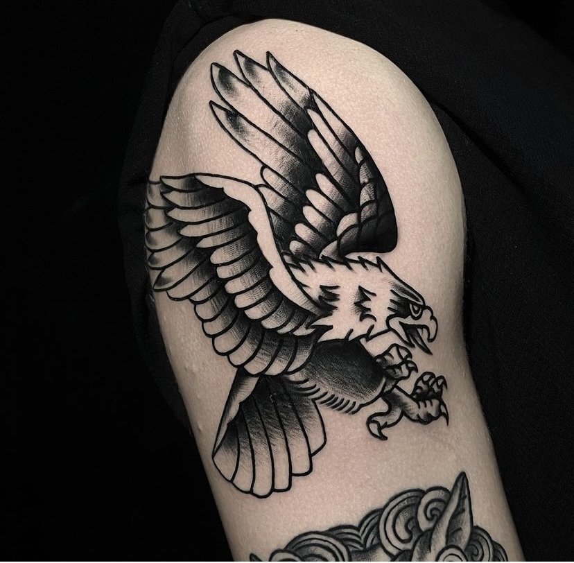 American Eagle tattoo idea on arm in blackwork tattoo style