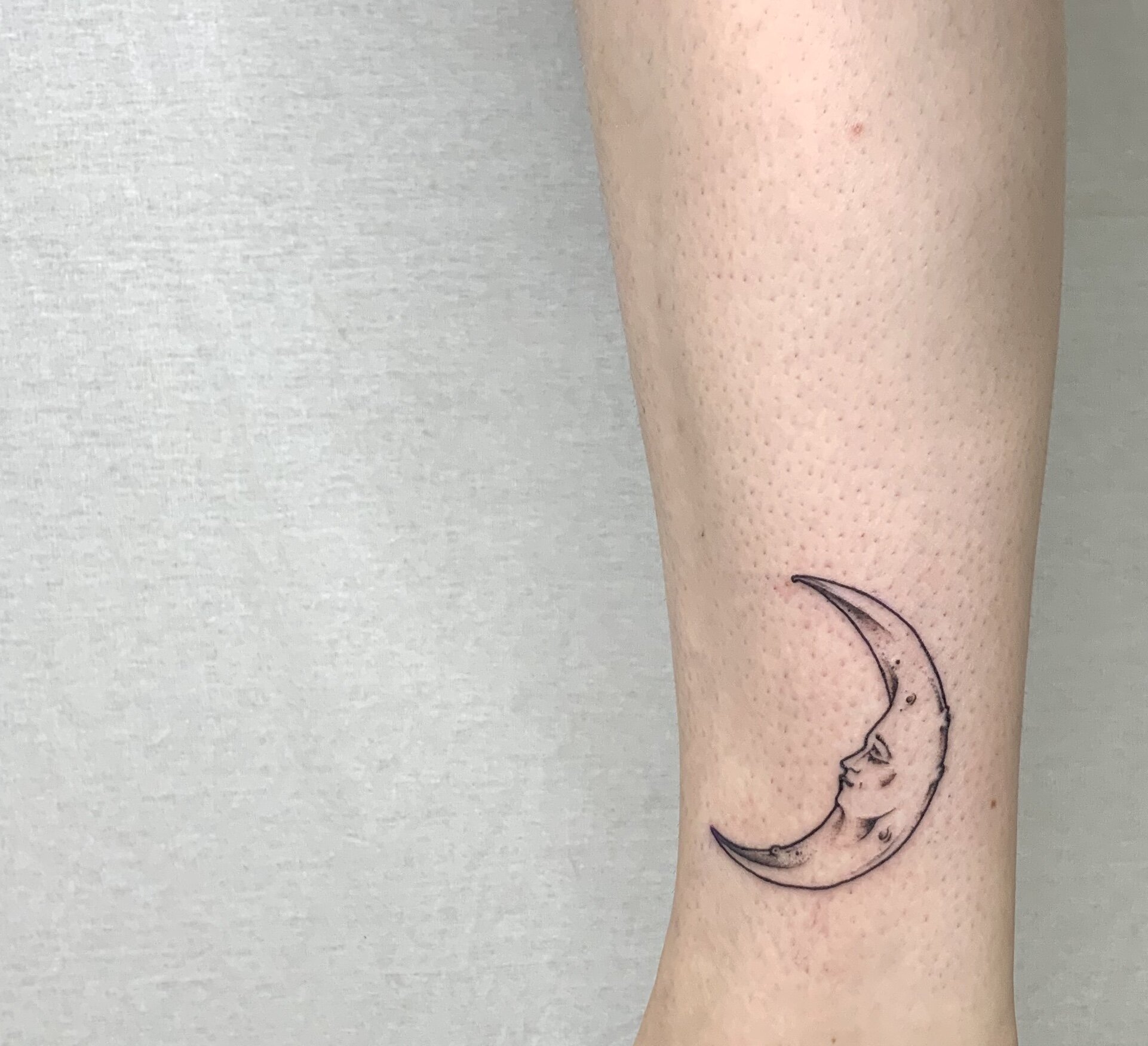 Small half moon tattoo in fine lines Tattoo style