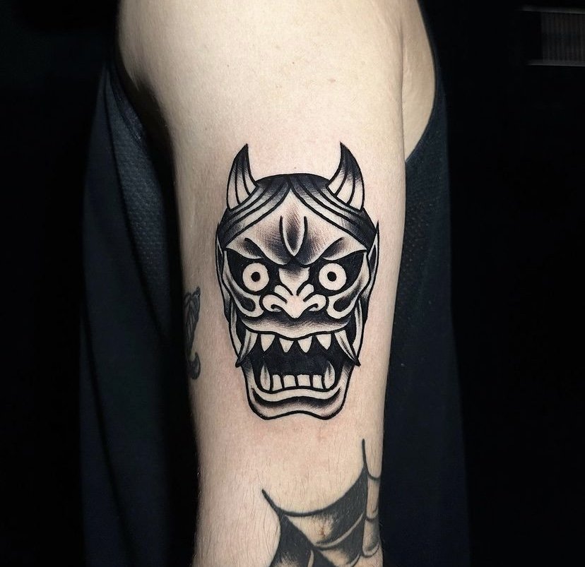 Japanese hanya mask tattoo idea on shoulder in blackwork tattoo style