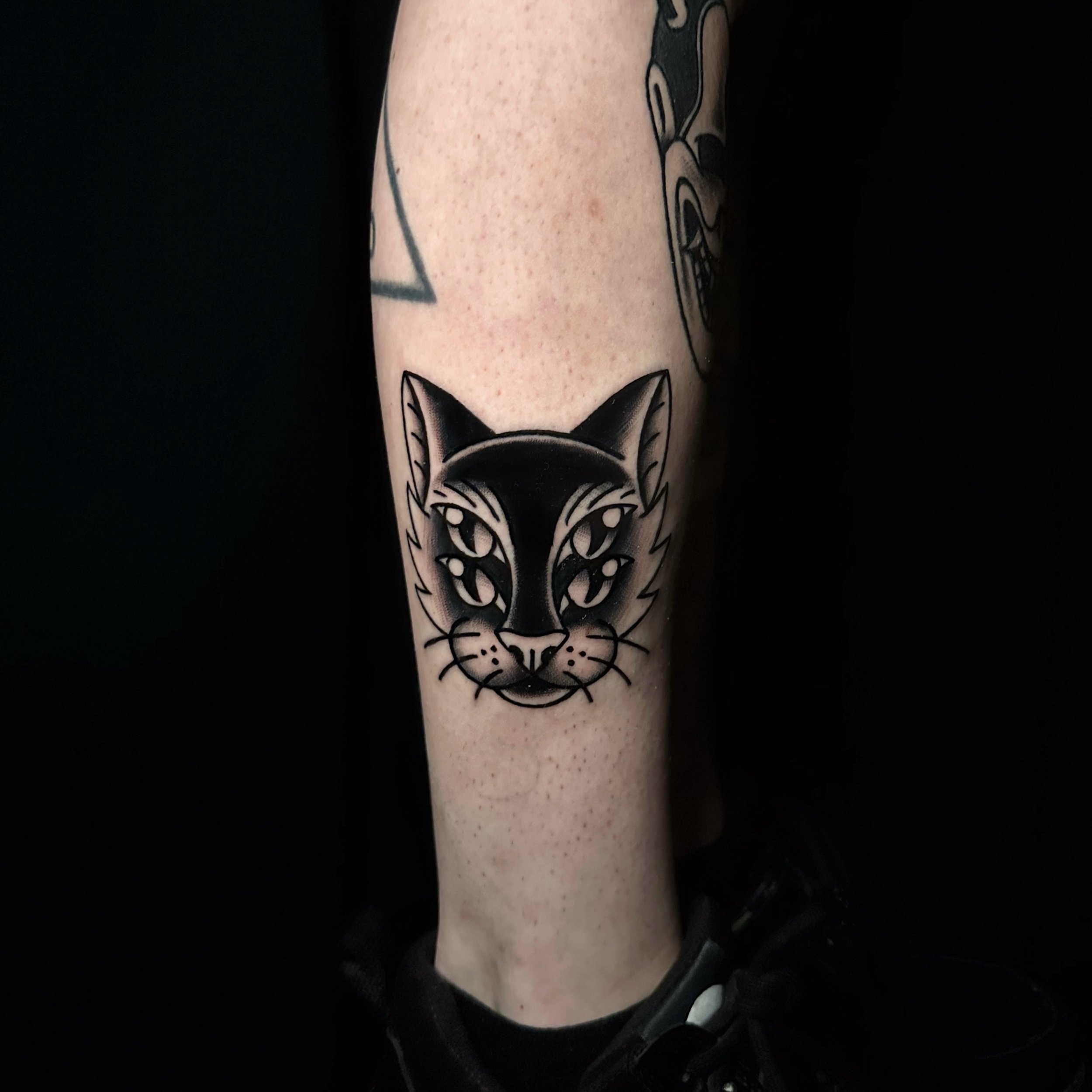 Cat tattoo idea in blackwork tattoo style