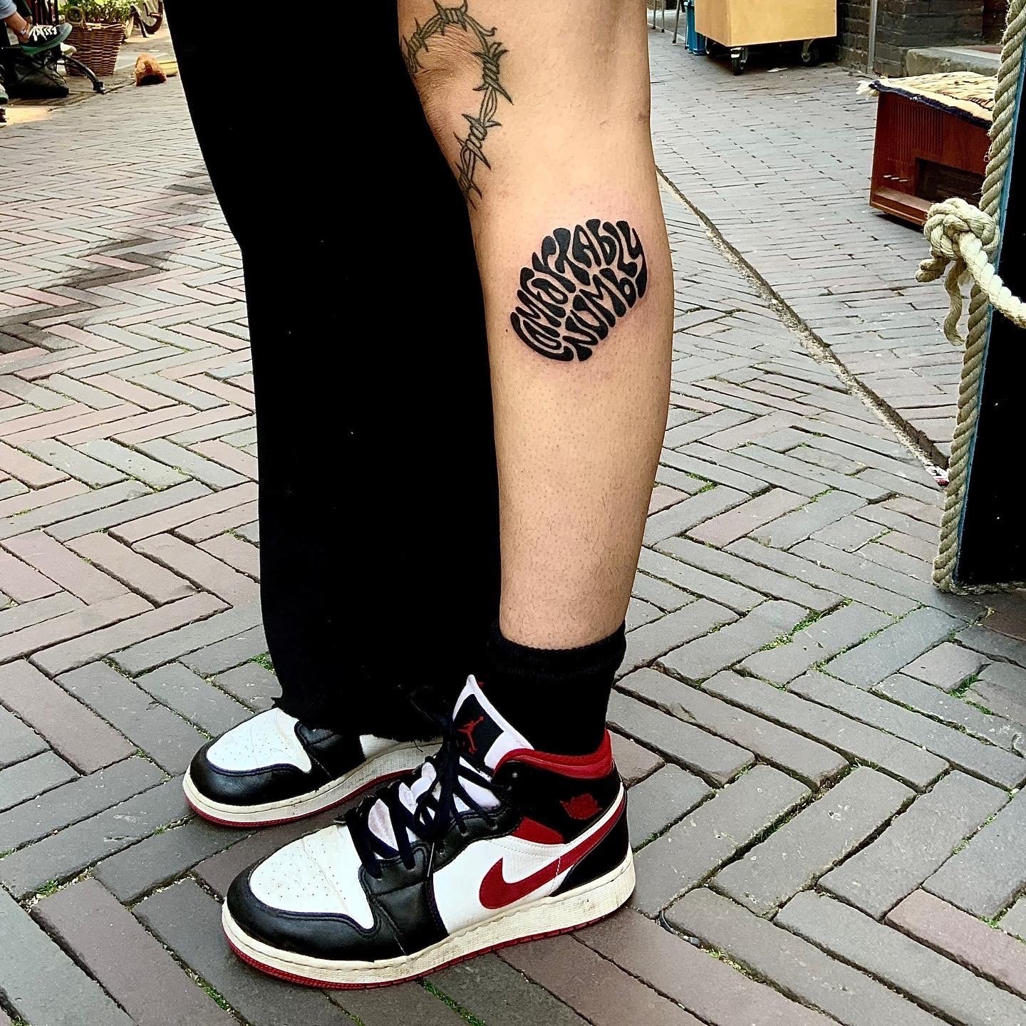 Word Art tattoo idea in blackwork tattoo style