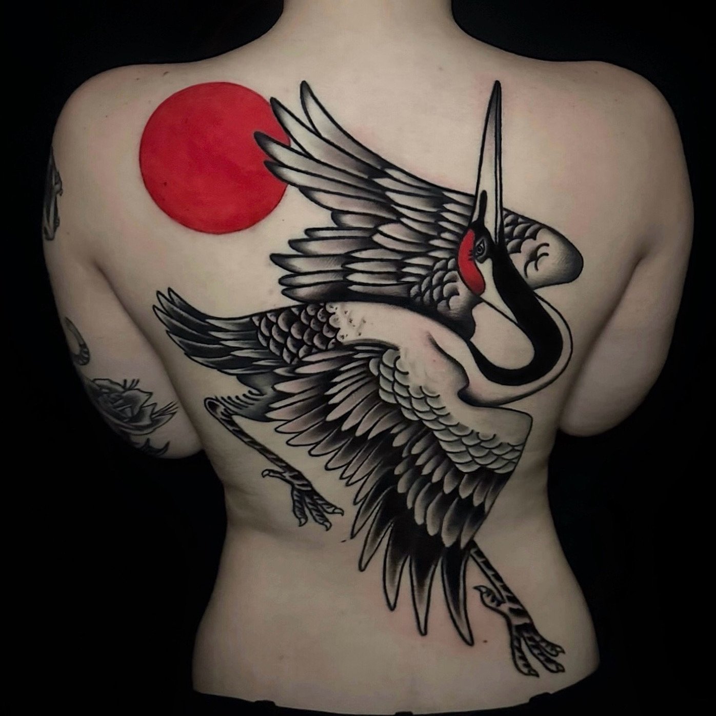 Back Tattoo Idea of a stork and red sun in Japanese tattoo Style