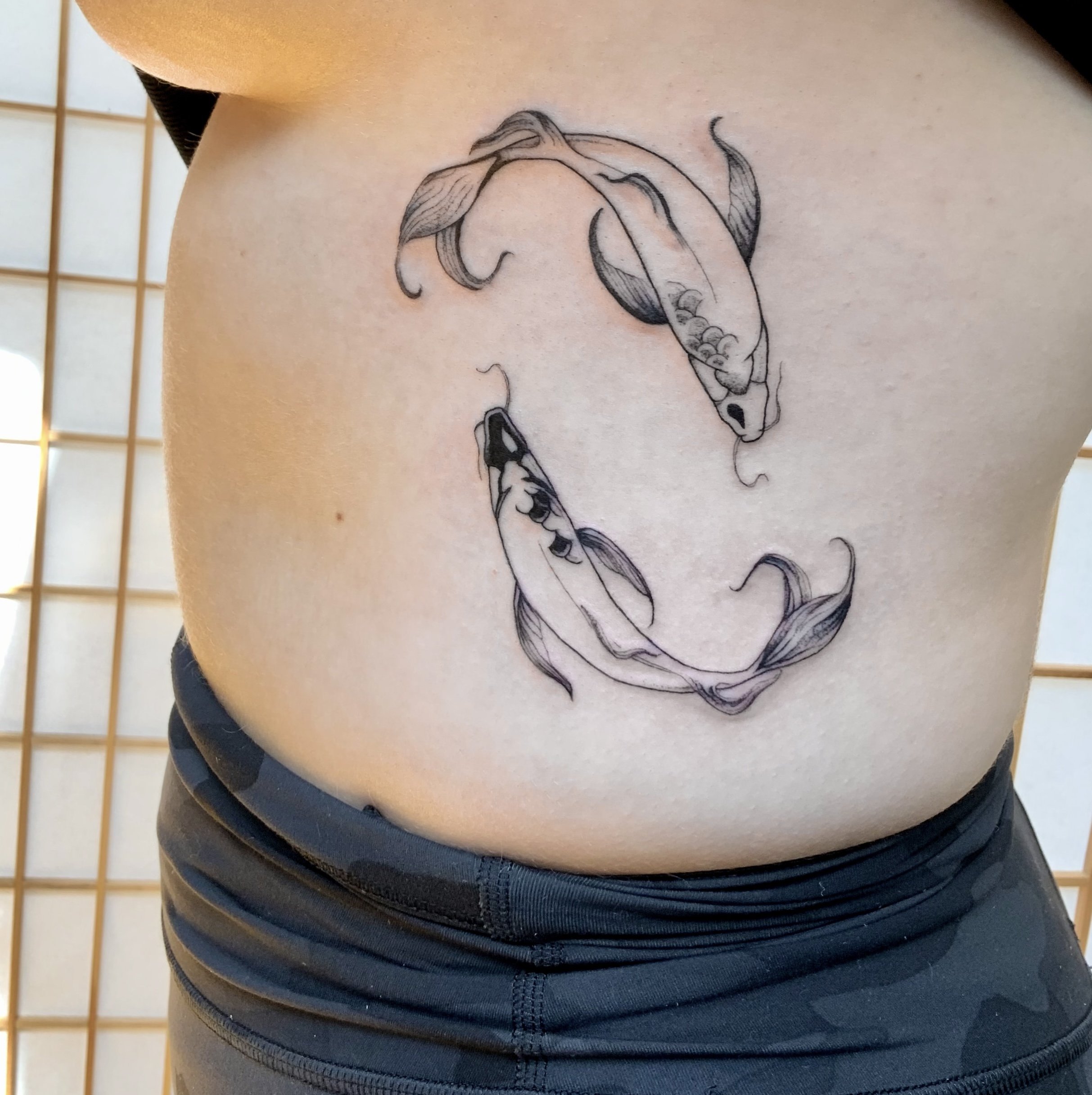 Fish tattoo idea in fine Lines tattoo
