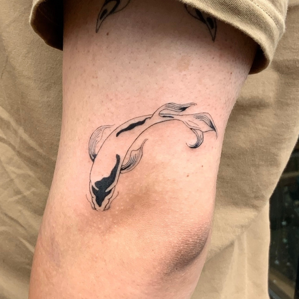 Fish tattoo idea in fine lines tattoo style