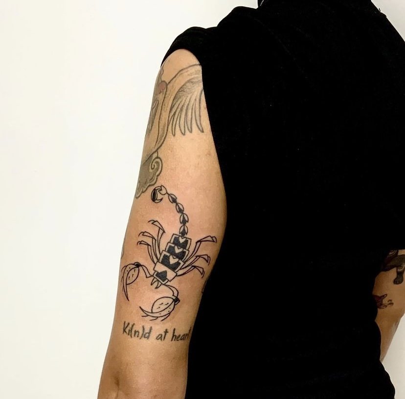 Scorpion tattoo idea on arm in blackwork tattoo style