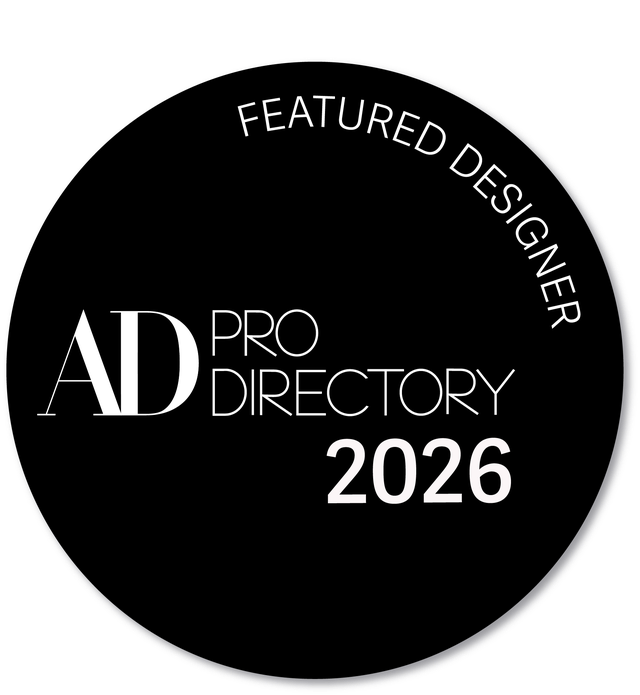 “Black circular badge reading ‘AD Pro Directory 2026’ with curved text ‘Featured Designer’ around the edge, indicating a professional design recognition.”