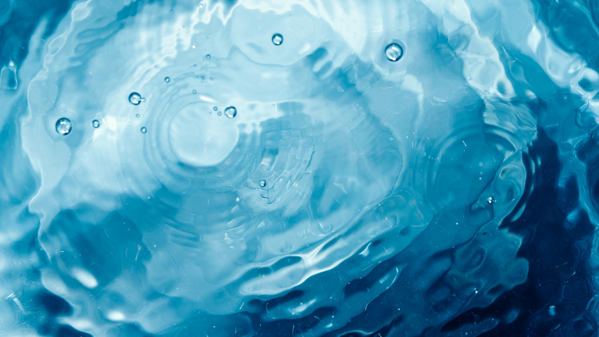Close-up of rippling water with bubbles Bend Thoughts & Therapy in Bend, OR.