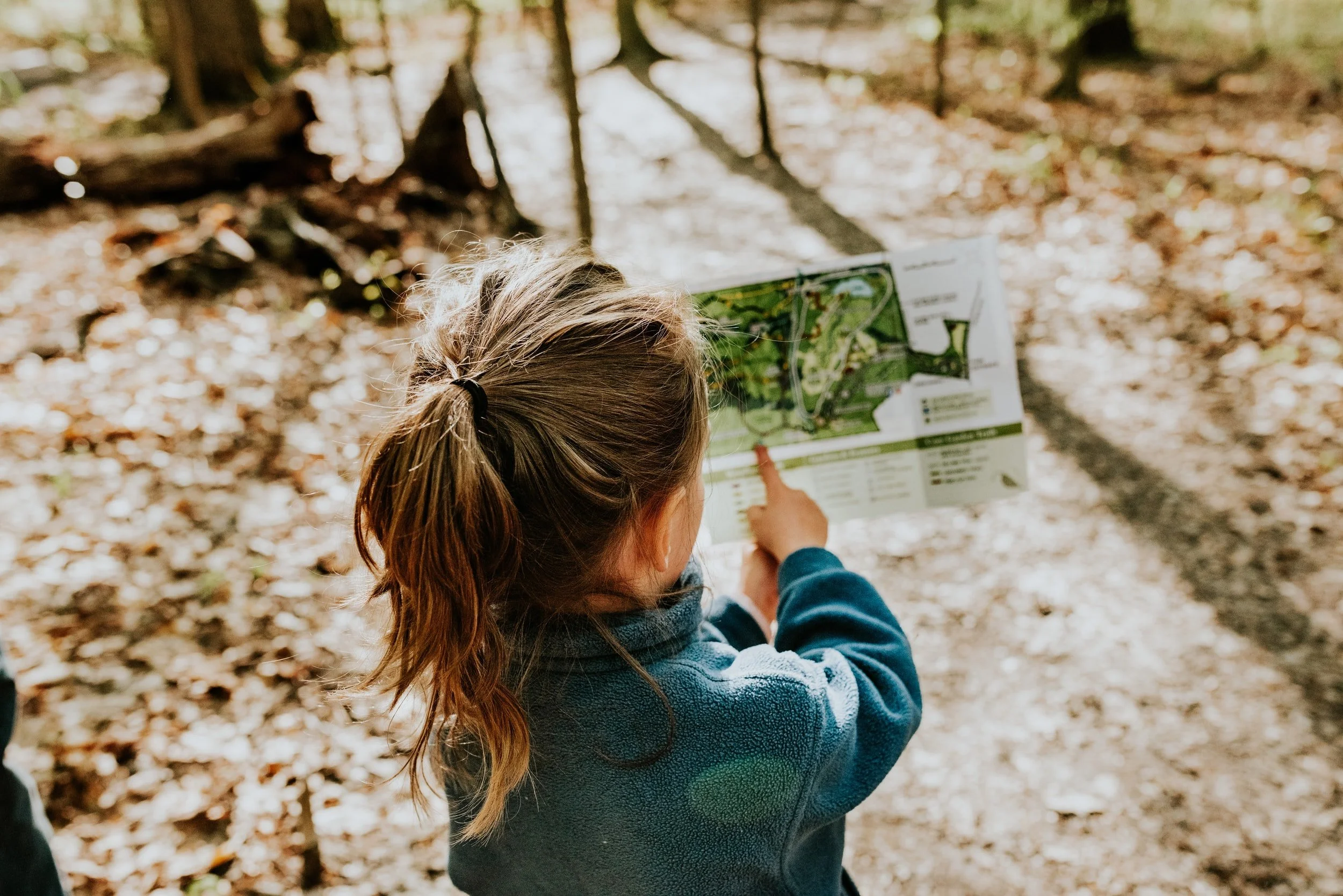 Photo of a custom map with a child pointing at map
