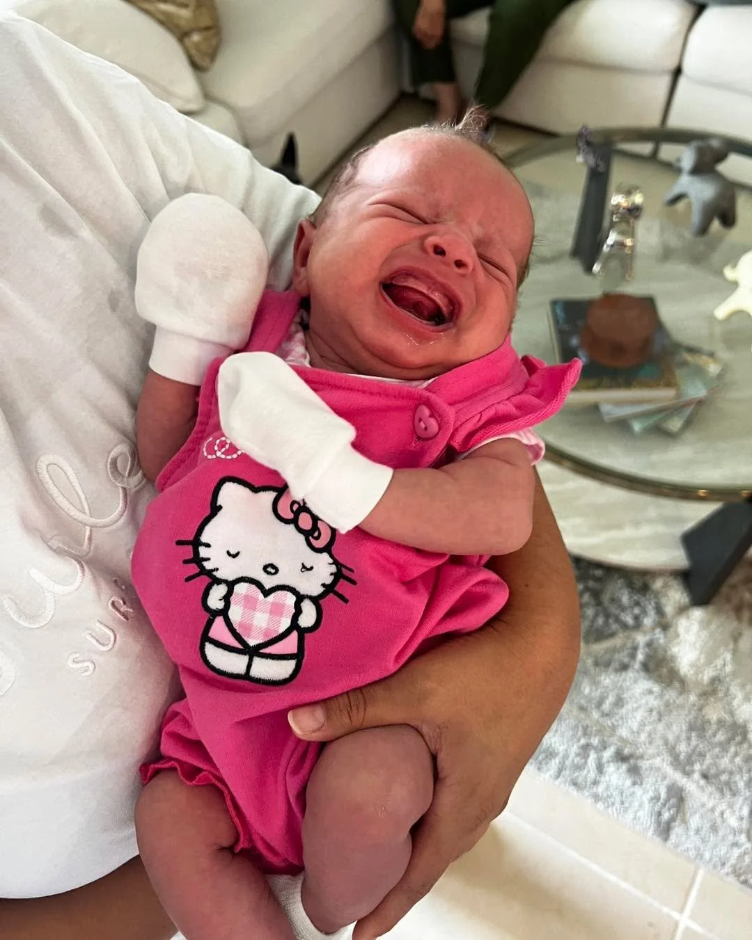 Despite the crying, girl is lookin&rsquo; good in that Hello Kitty.