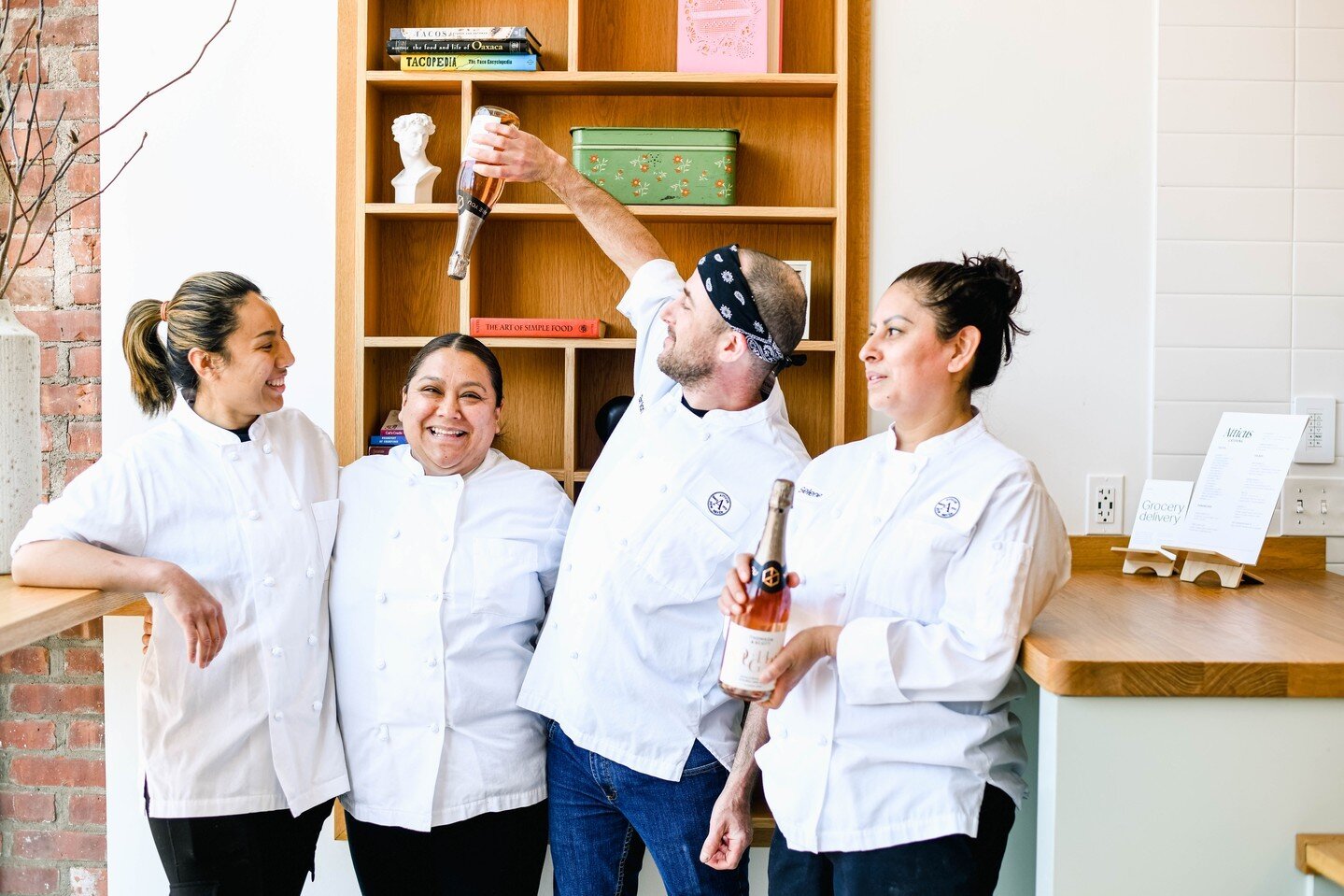 The Atticus Bakery leadership team unwinding (with dealcoholized sparkling wine😉). From left: Cha (lead baker), Odilia (lead baker), Brian (bakery manager), Selene (pastry chef).