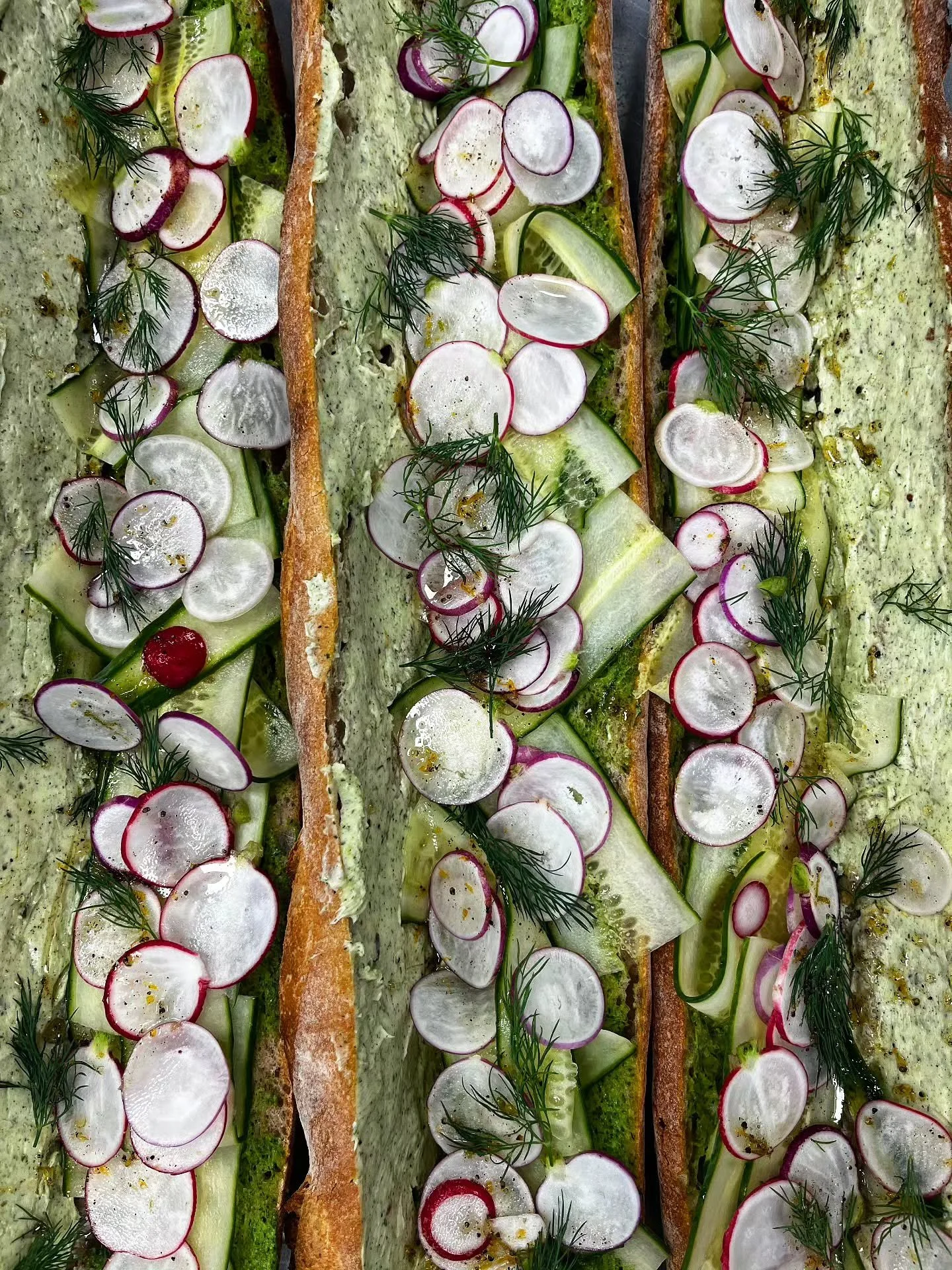 Happy first day of spring 🌱

We're celebrating with bright baguette sandos🌞

@atticusbakery baguette with thinly sliced Easter egg radishes, cucumbers, whipped honey butter, radish top pesto &amp; dill 

Available every Friday &amp; Saturday now th