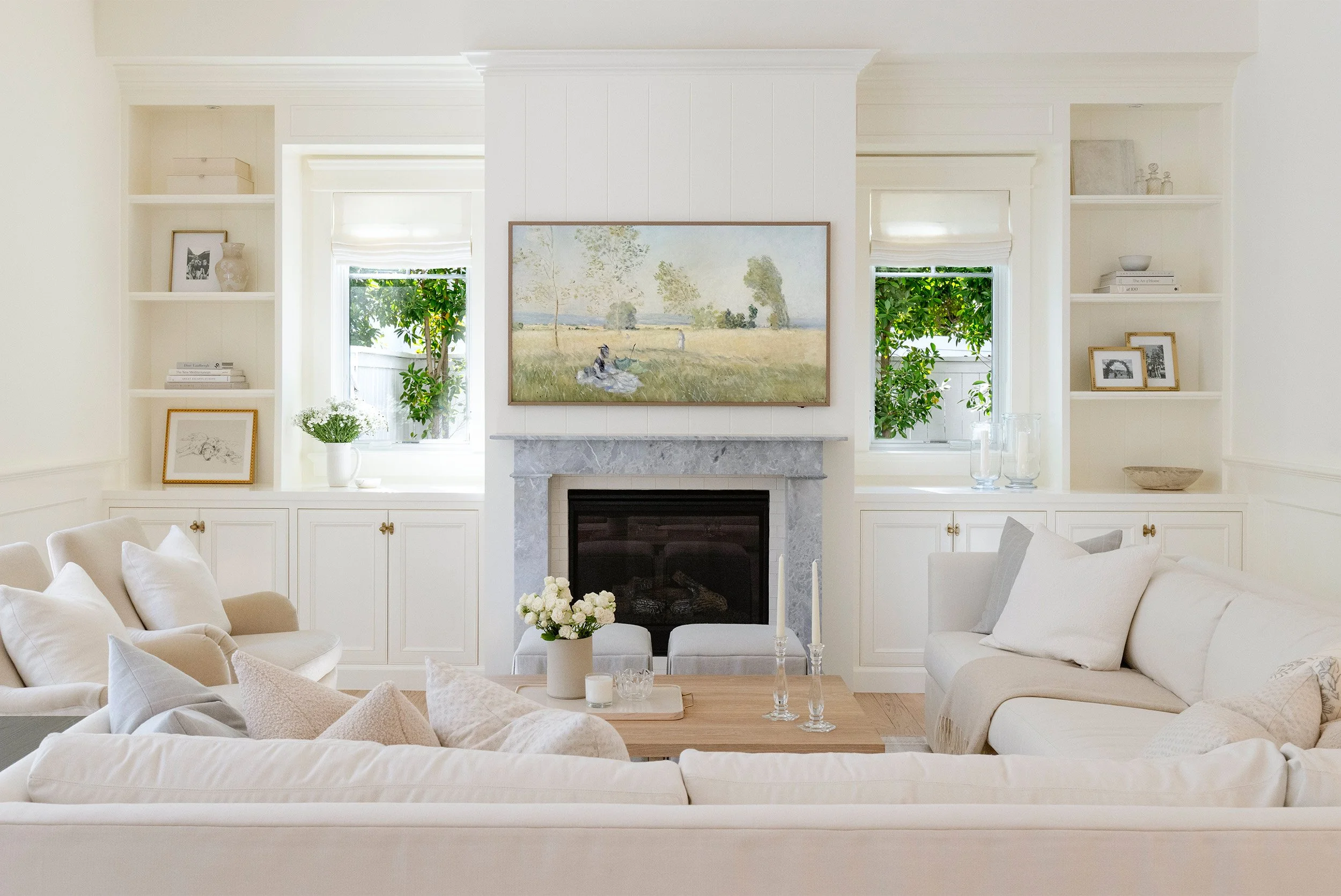 Orange County interior design photographer captures bright living room with marble fireplace and built-ins