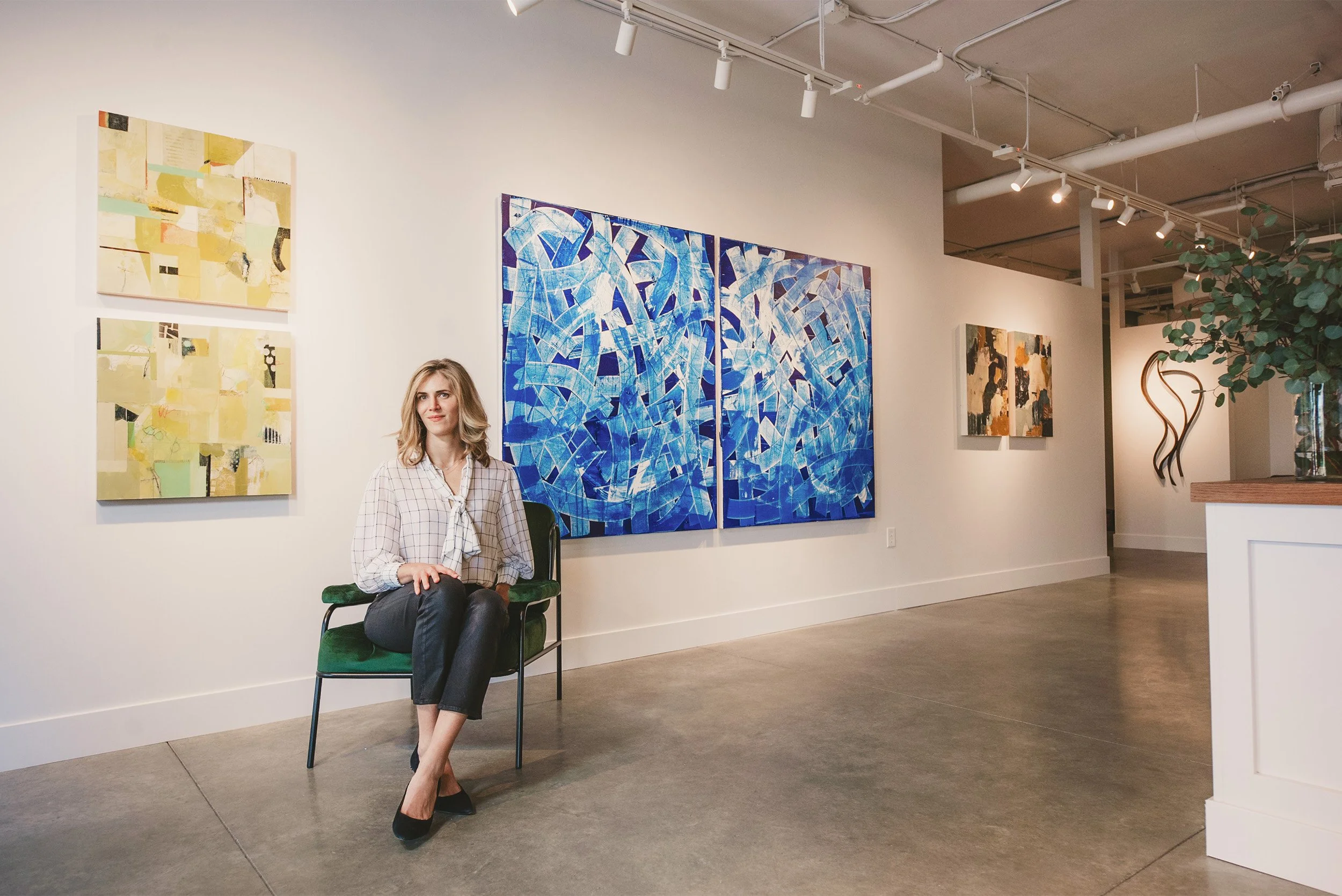 Award-winning brand photographer captures portrait among blue abstract artwork