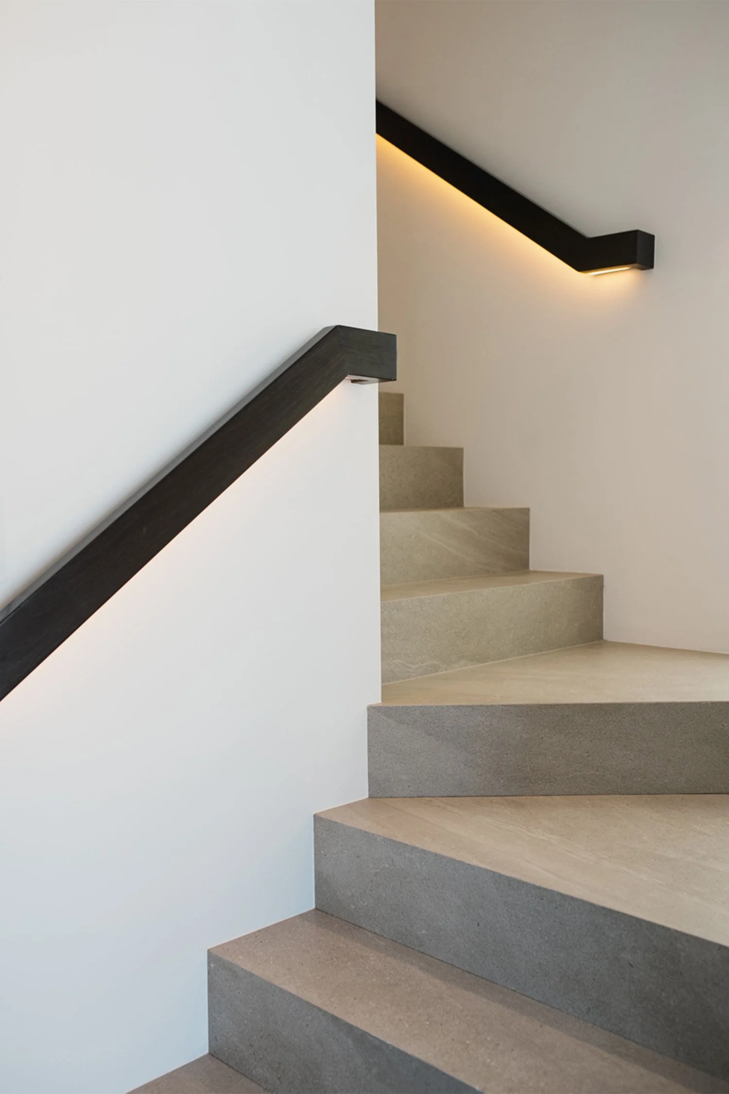 Interior architectural photography of contemporary staircase with backlit handrail detail, Orange County real estate photographer
