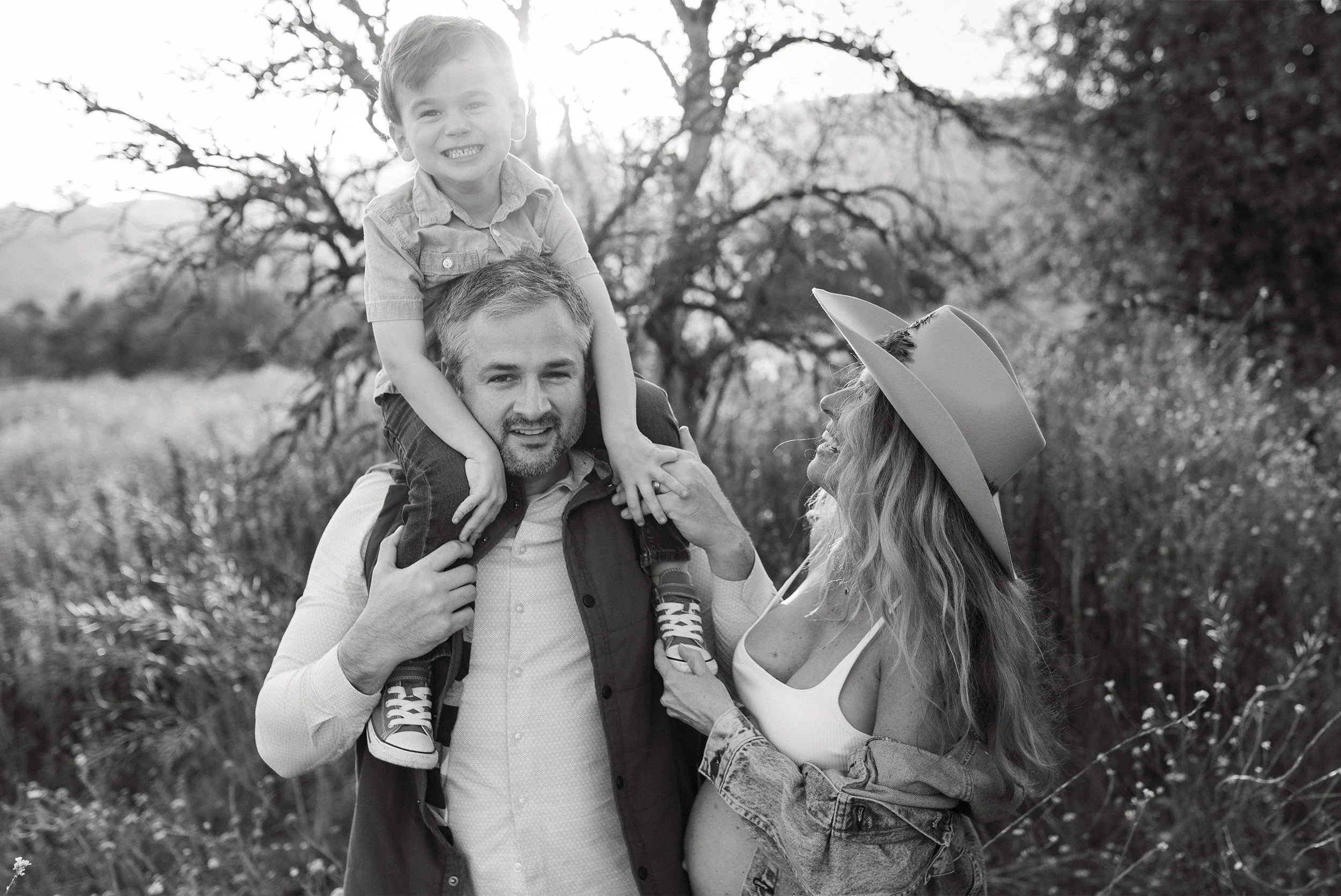 Highly recommended maternity photographer in Orange County captures playful family portrait at golden hour