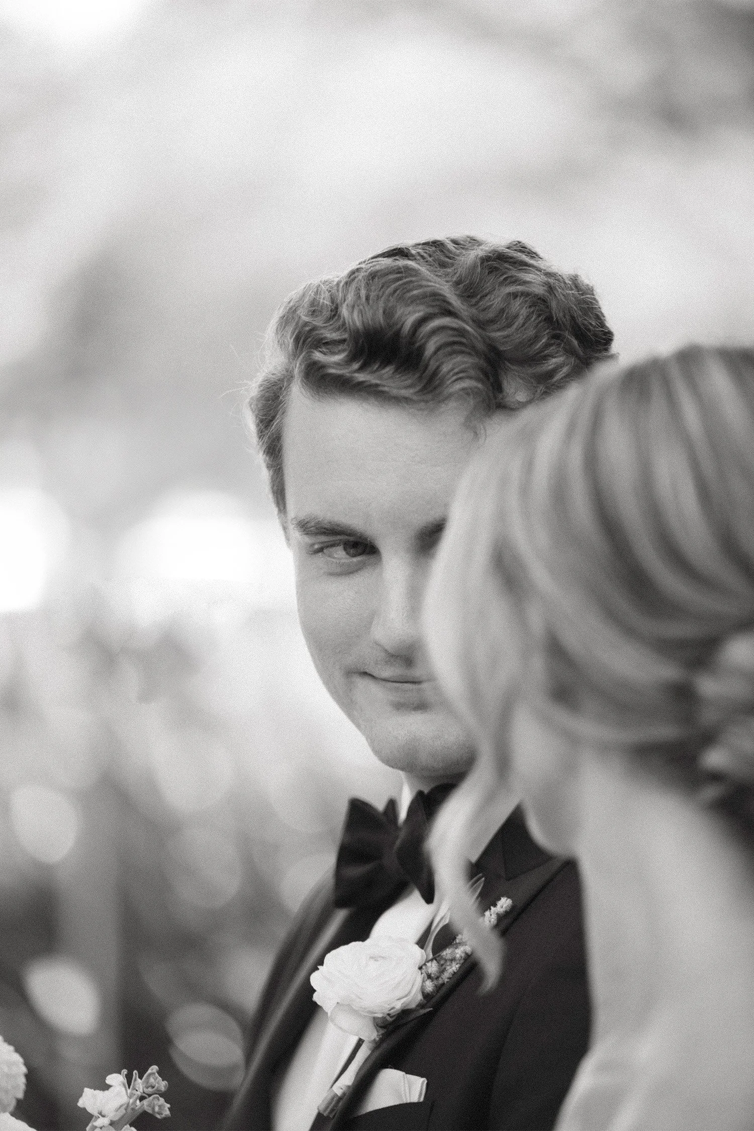 Orange County wedding photographer captures intimate candid moment of groom looking lovingly at his bride, black and white, The Ranch at Laguna Beach wedding venue
