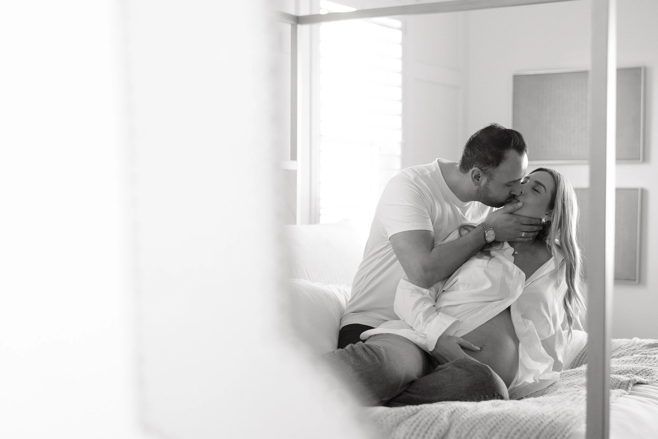 Orange County maternity photographer captures intimate moment between couple during in-home session, in home family photos