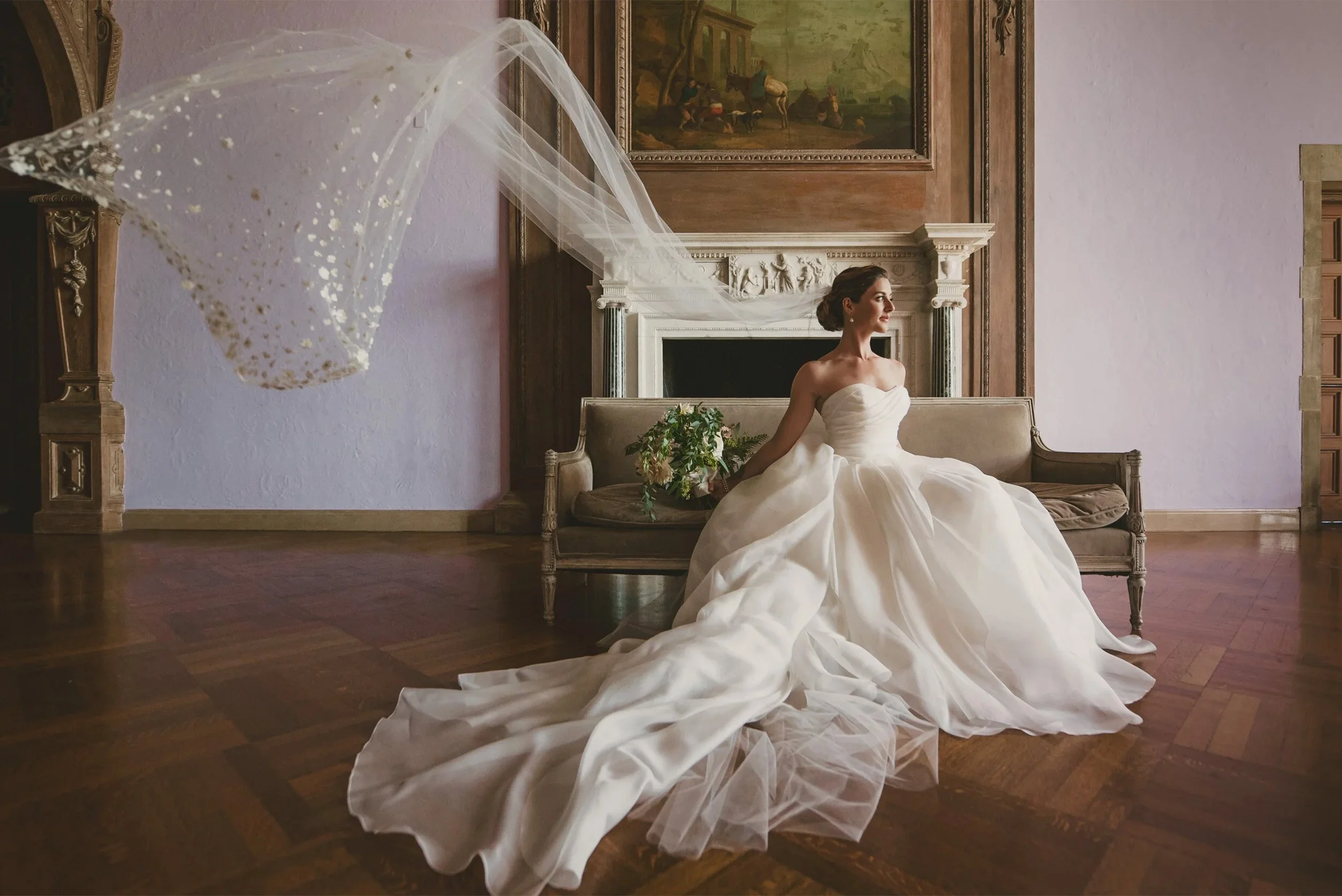 Bride in ball gown with veil flowing indoors at the historic mansion wedding venue Greystone Mansion Beverly Hills
