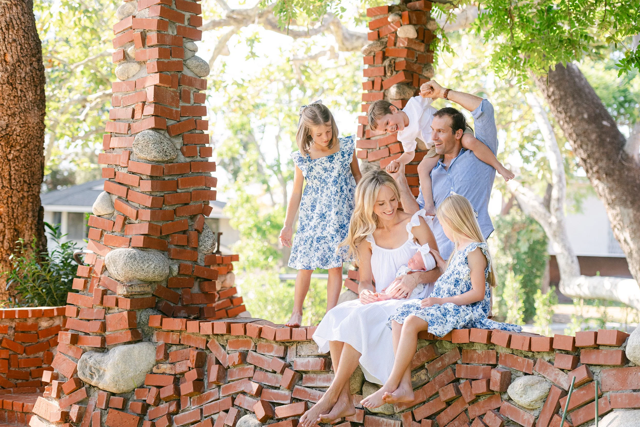 Orange County family photographer captures playful multi-generational portrait with newborn baby, in home family session