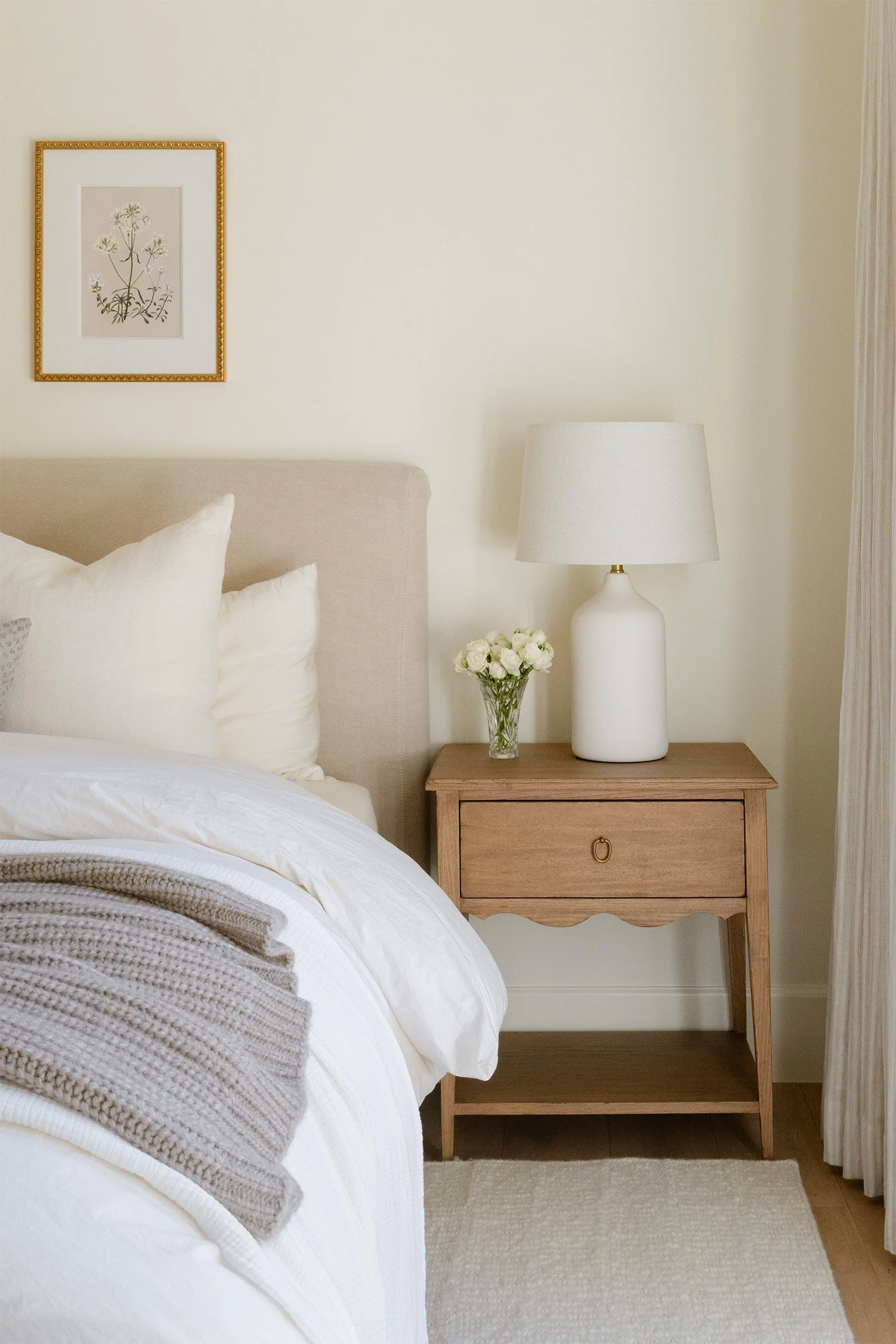 Award-winning interior design photographer in Orange County captures cozy bedroom nightstand styling