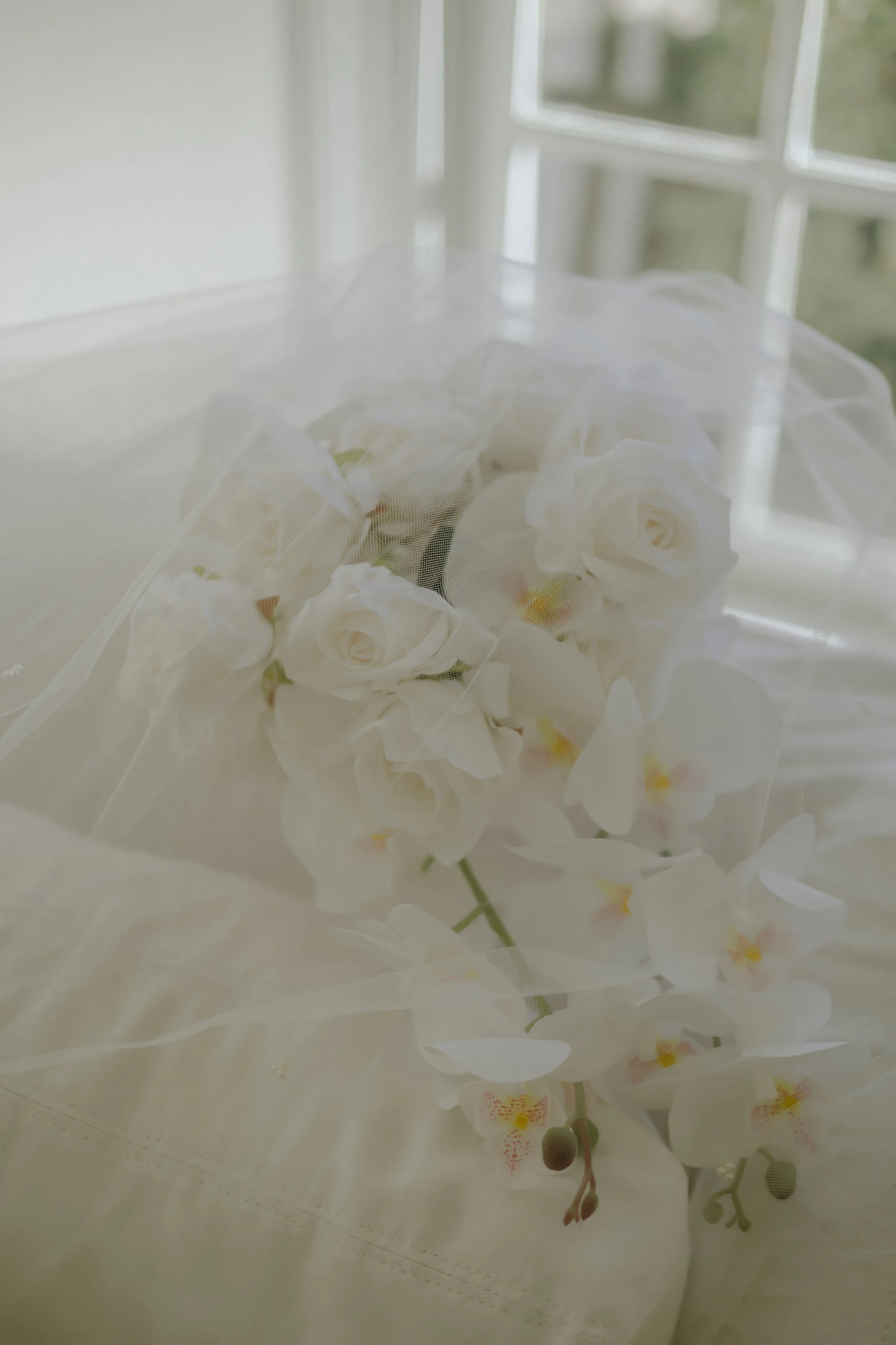 Houston & Texas Family, Couples, Newborn, Maternity, Bridal Photography – Bride in full gown beneath chandelier, Houston venue.