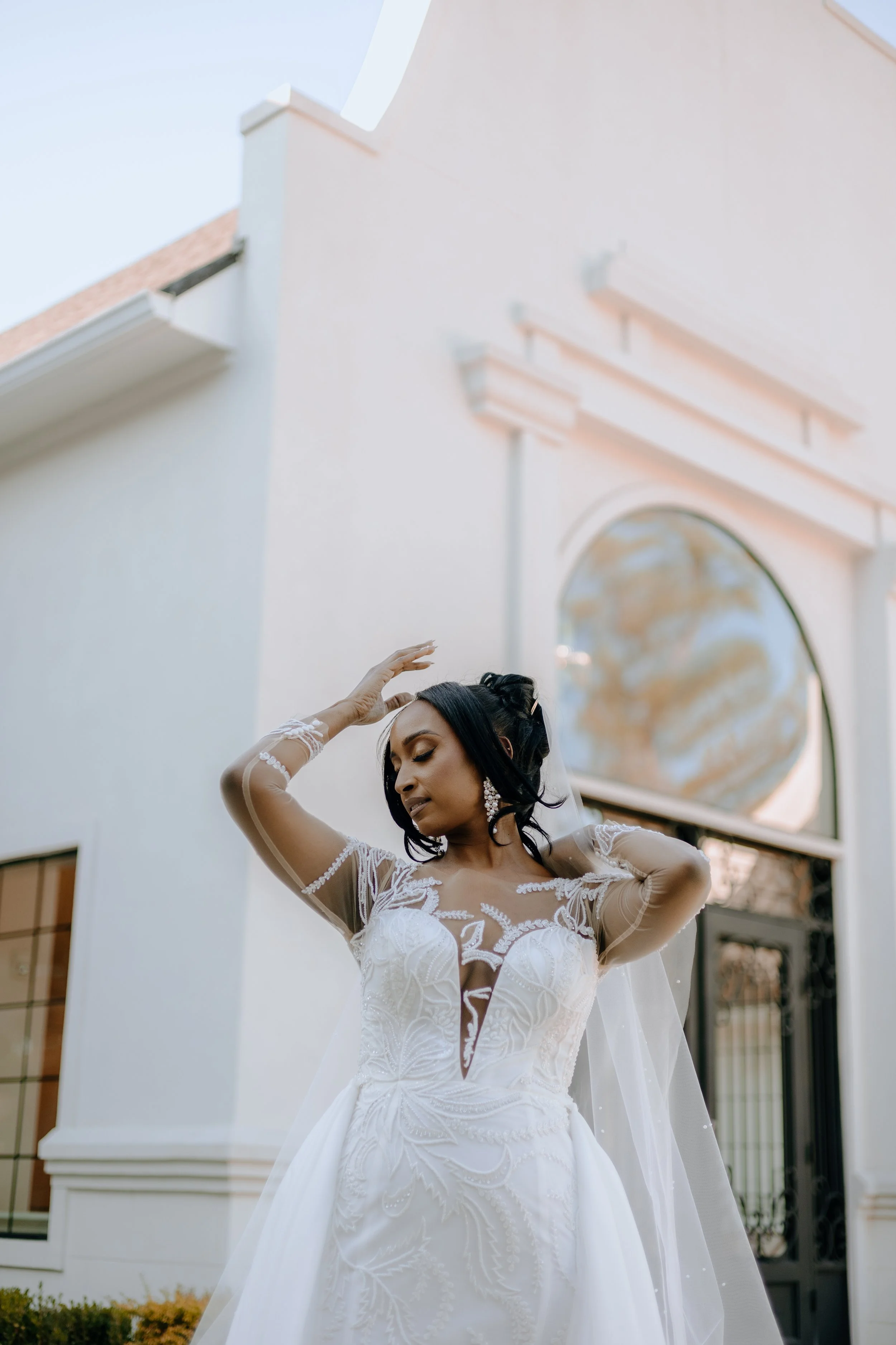 Houston & Texas Family, Couples, Newborn, Maternity, Bridal Photography – Bride adjusting veil outdoors at Peach Orchard Venue.