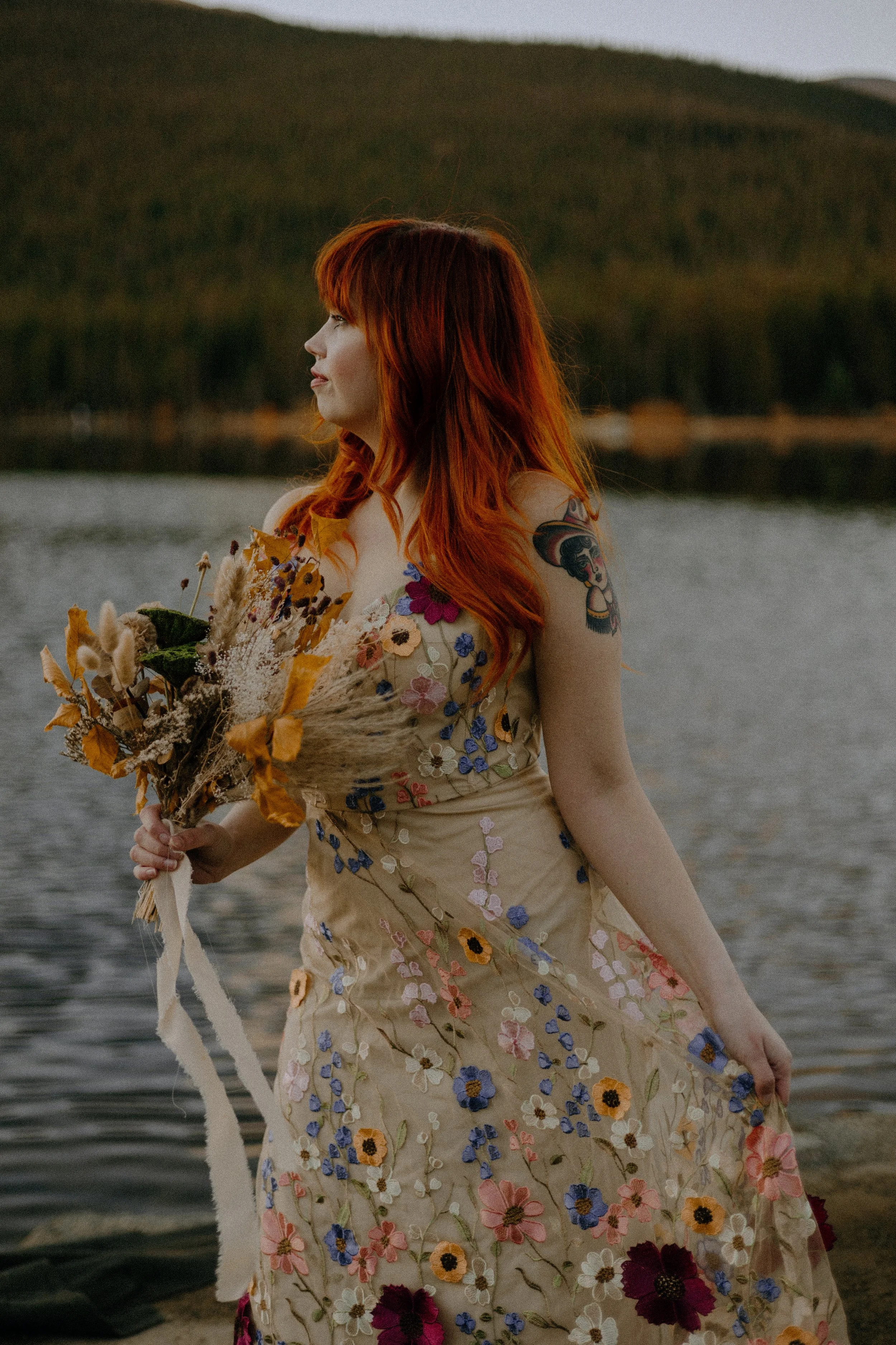 Houston & Texas Wedding & Elopement Photography – Bride holding bouquet of fall florals by Echo Lake Colorado elopement.