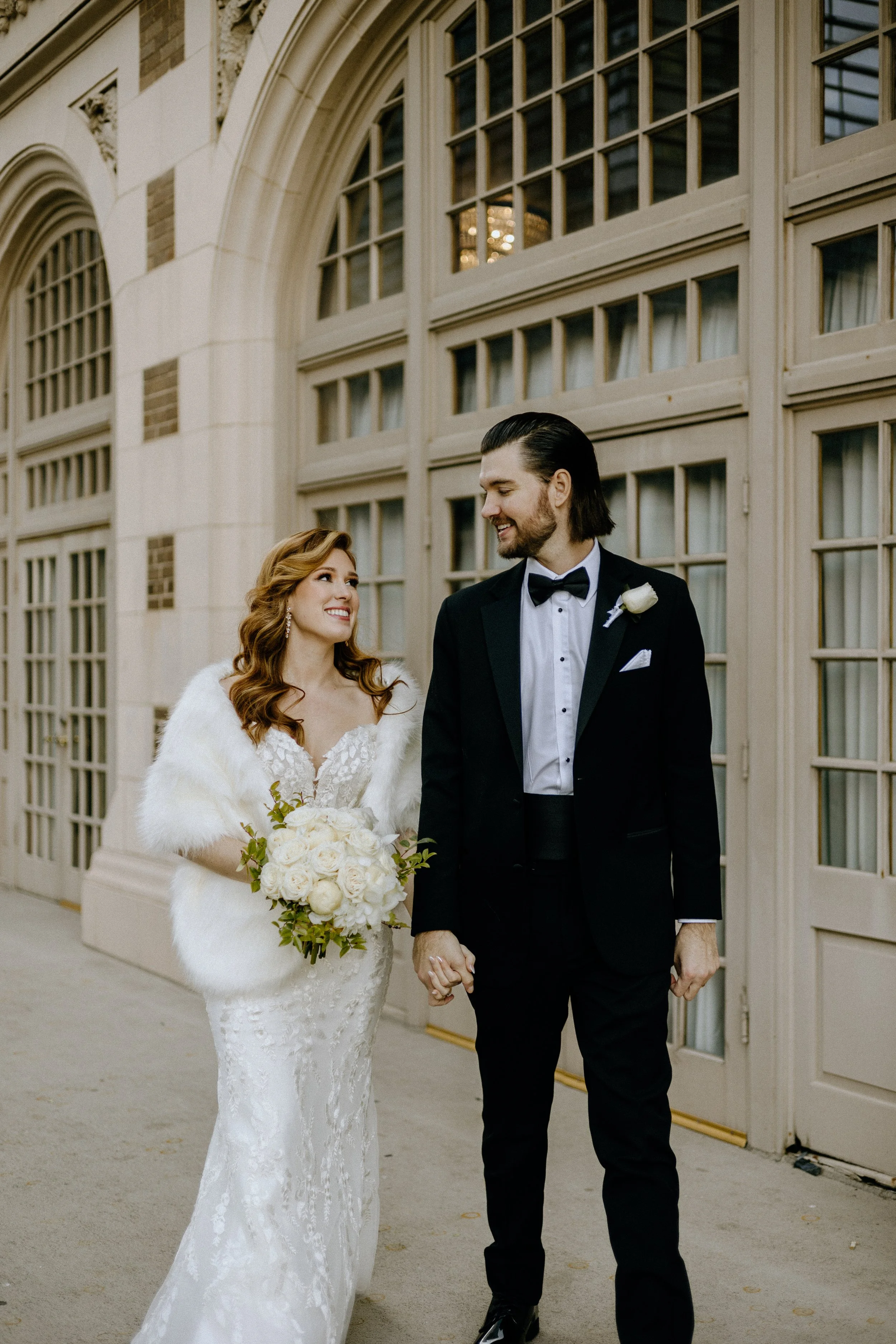 Golden Hour Wedding Venue, Houston TX – bride and groom strolling downtown streets outside Crystal Ballroom at The Rice during golden hour