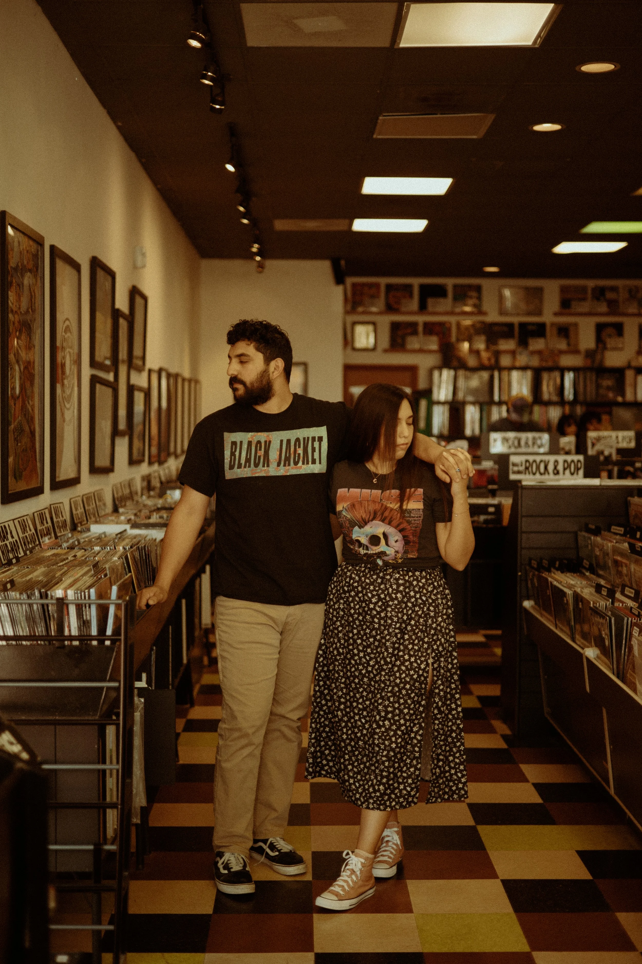 Couples Portrait Photography, Houston TX – couple browsing records in downtown Houston shop with nostalgic vibe