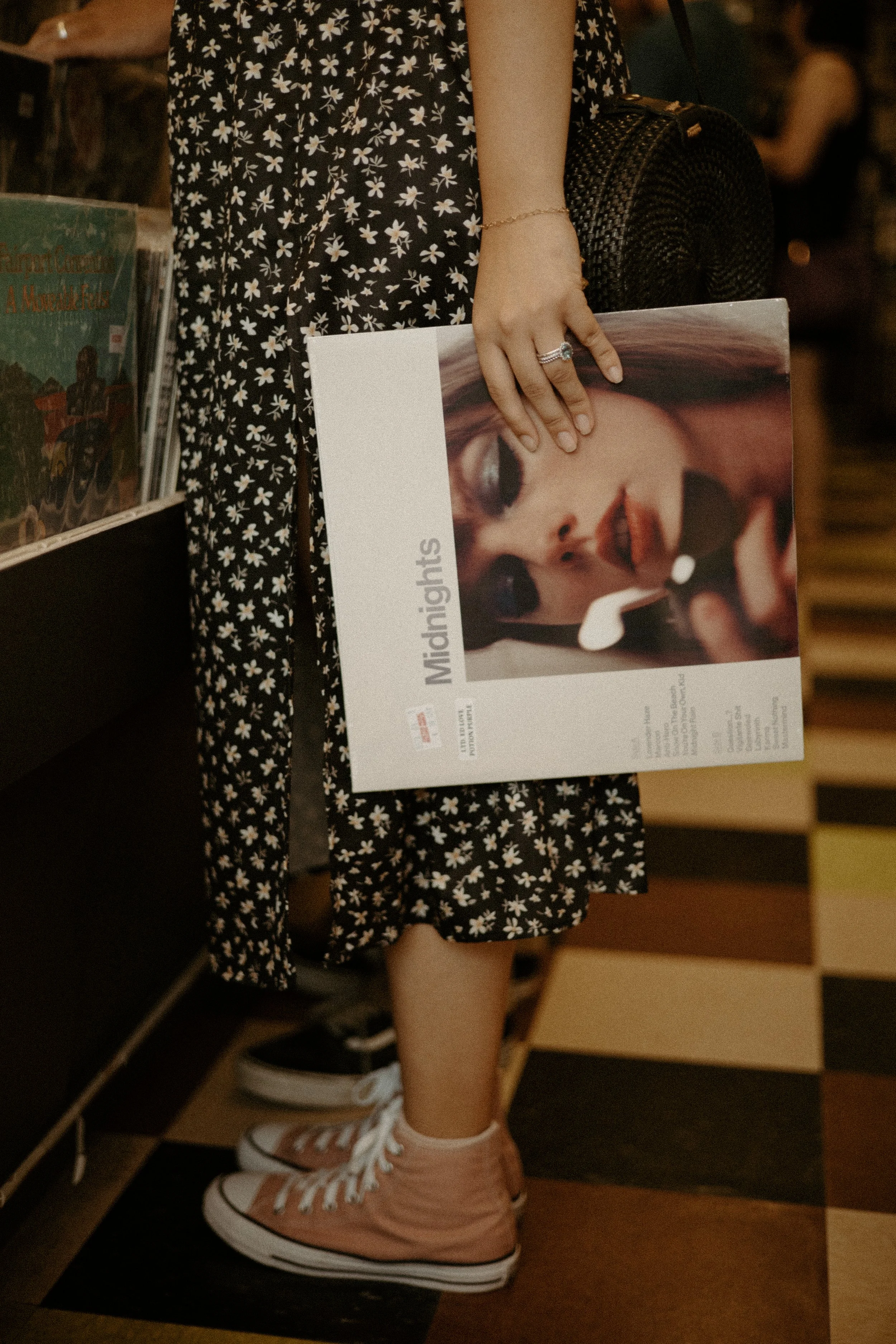 Couples Portrait Photography, Houston TX – detail of woman holding album while standing near checkered floor