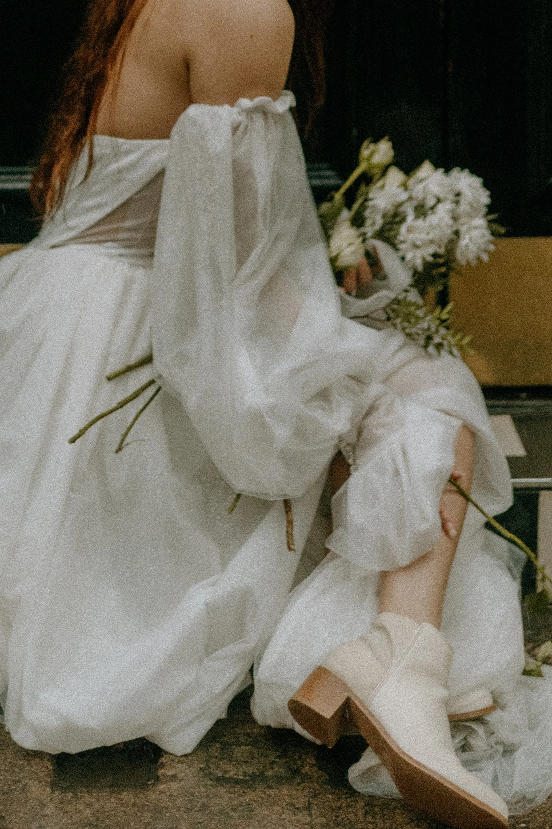 Bridal portraits – wedding &amp; engagement photography of bride captured in motion under soft rain outside The Golden Fleece