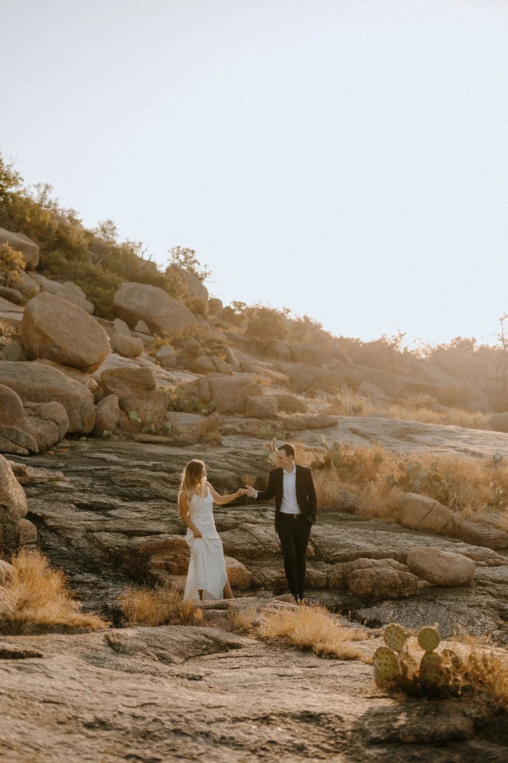Wedding+and+Elopement+photography,+Elopement+couple+hiking+through+Enchanted+Rock_