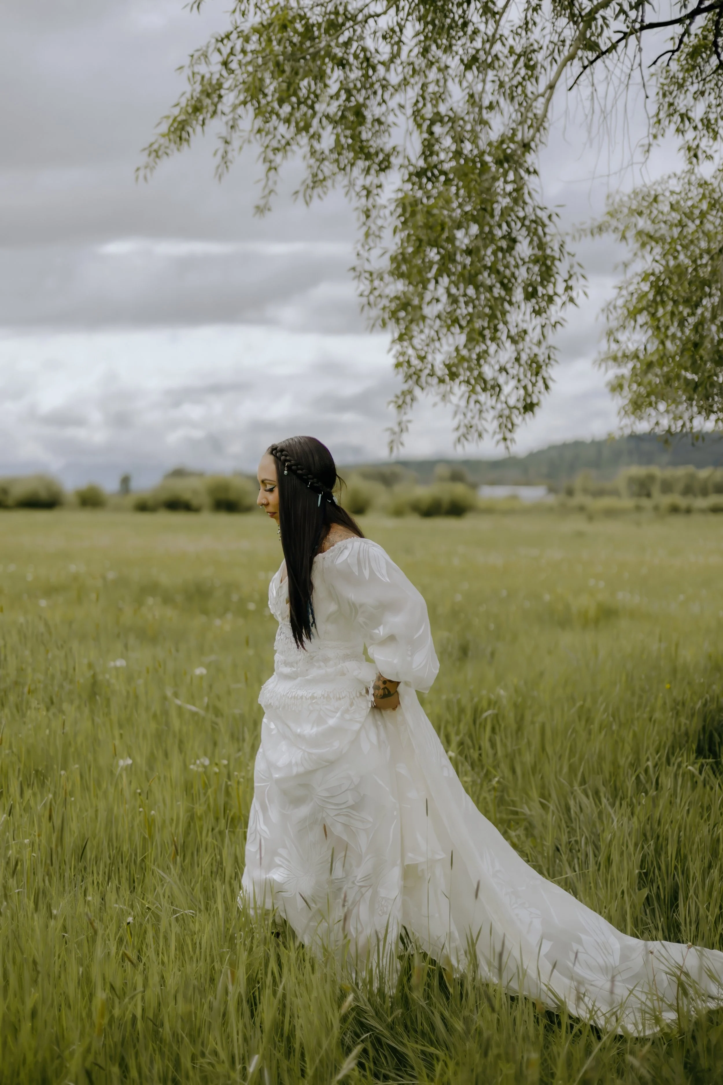 Houston & Texas Wedding & Elopement Photography – Bride walking across grassy field with veil drifting behind at Diamond Cross Ranch.