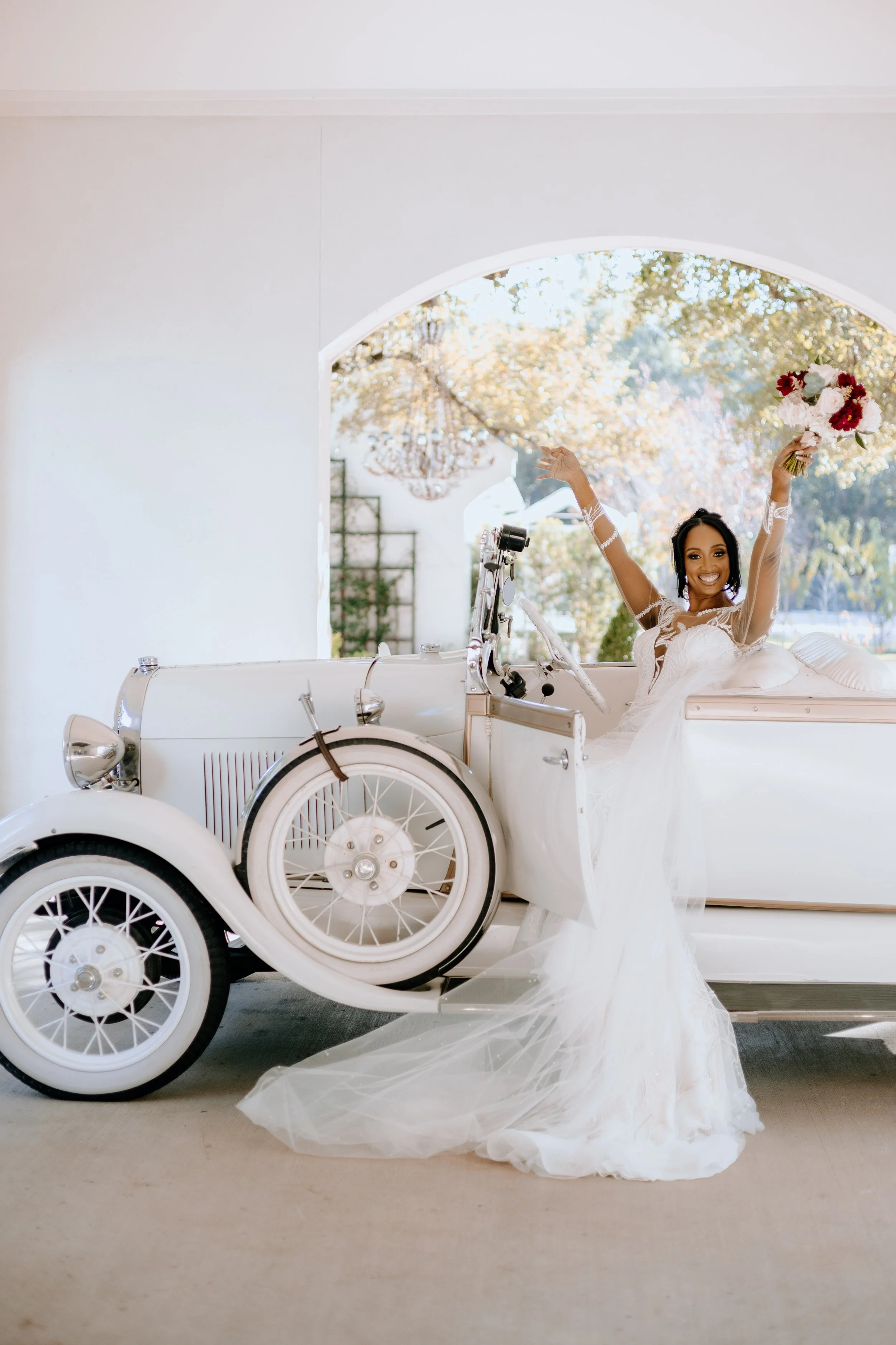Houston & Texas Family, Couples, Newborn, Maternity, Bridal Photography – Bride standing proudly beside vintage car, Peach Orchard Venue.