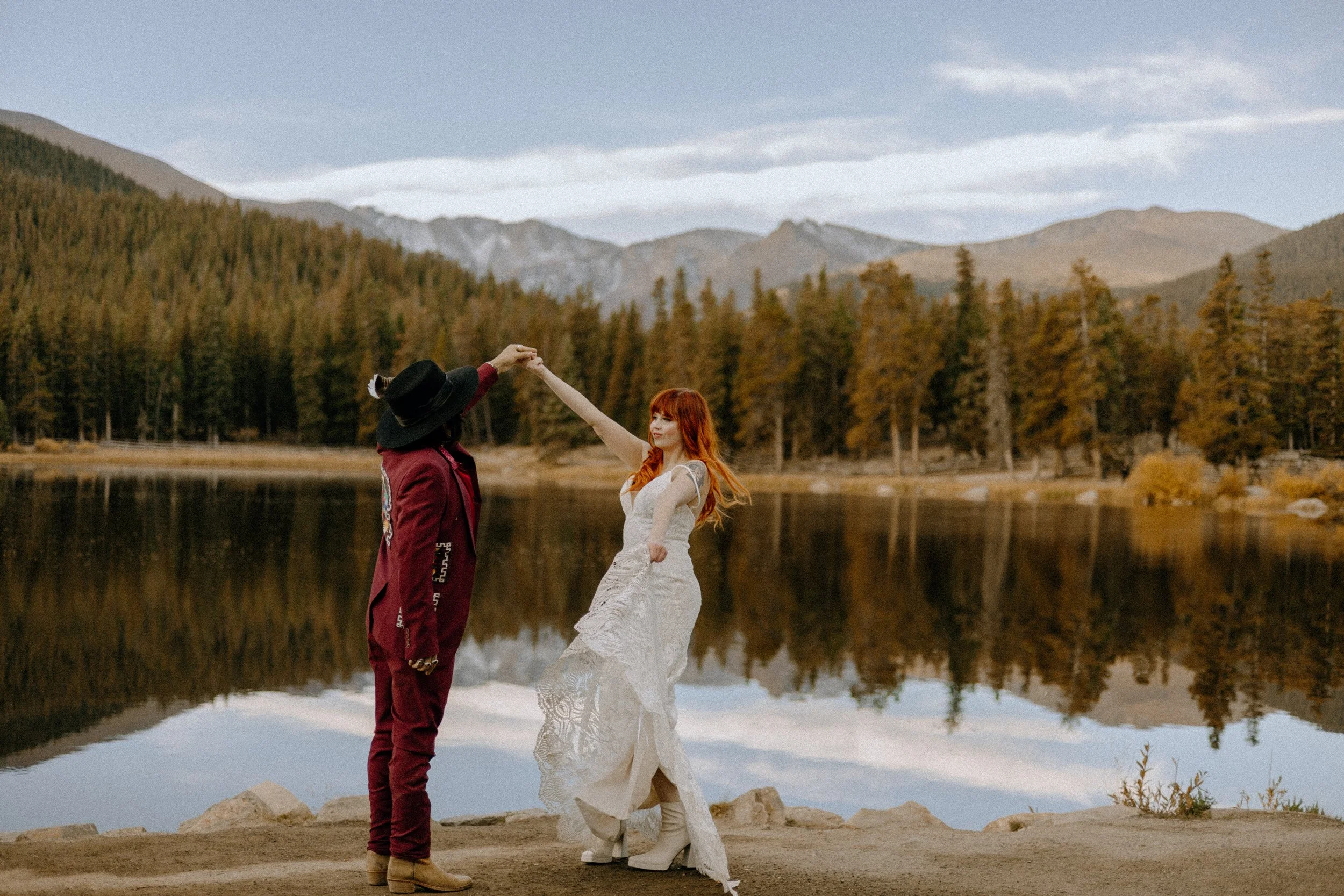 Houston & Texas Wedding & Elopement Photography – Groom twirling bride by alpine lake in Echo Lake Colorado.
