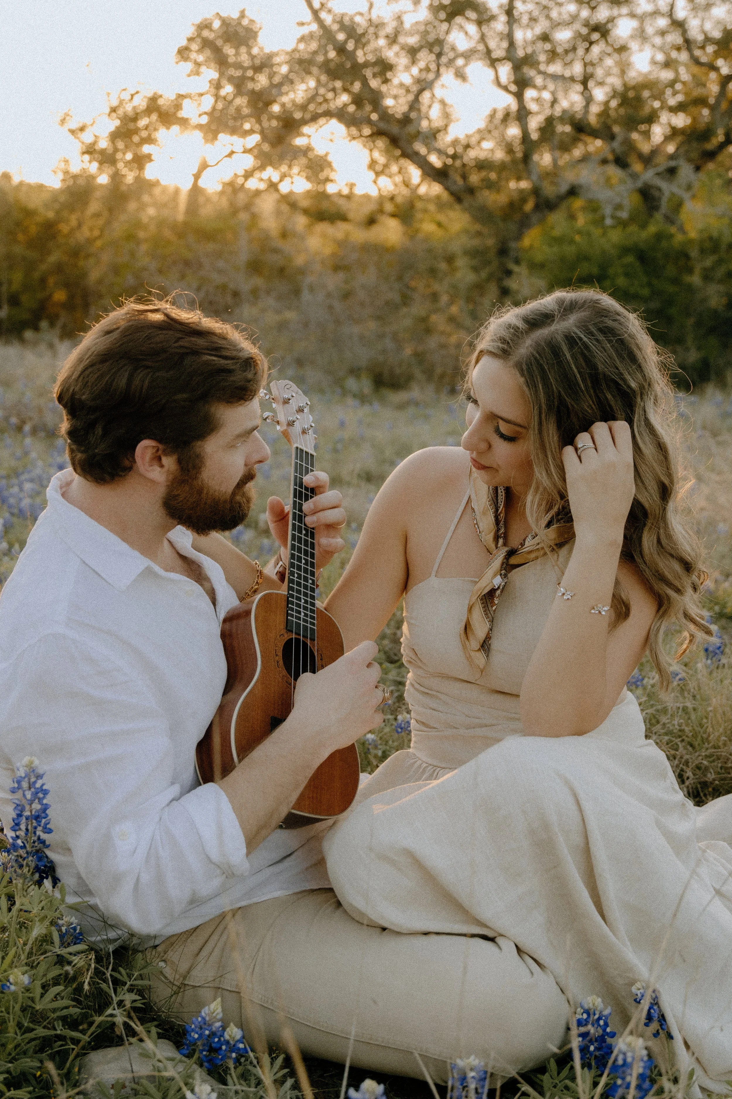 Houston & Texas Family, Couples, Newborn, Maternity, Bridal Photography – Candid laughter as couple plays guitar in Austin TX portraits.