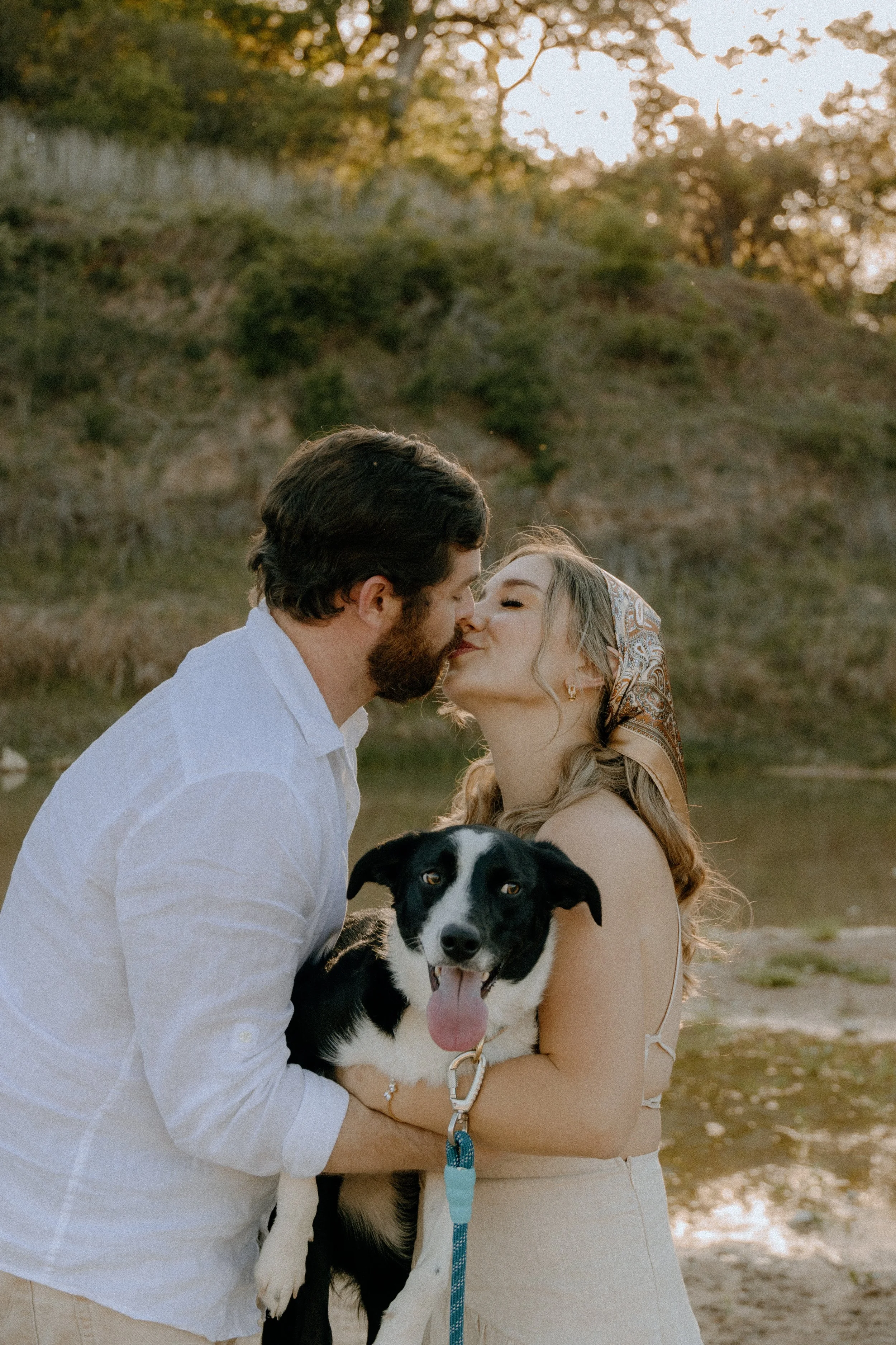 Houston & Texas Family, Couples, Newborn, Maternity, Bridal Photography – Playful kiss holding dog in Austin TX golden sunset.