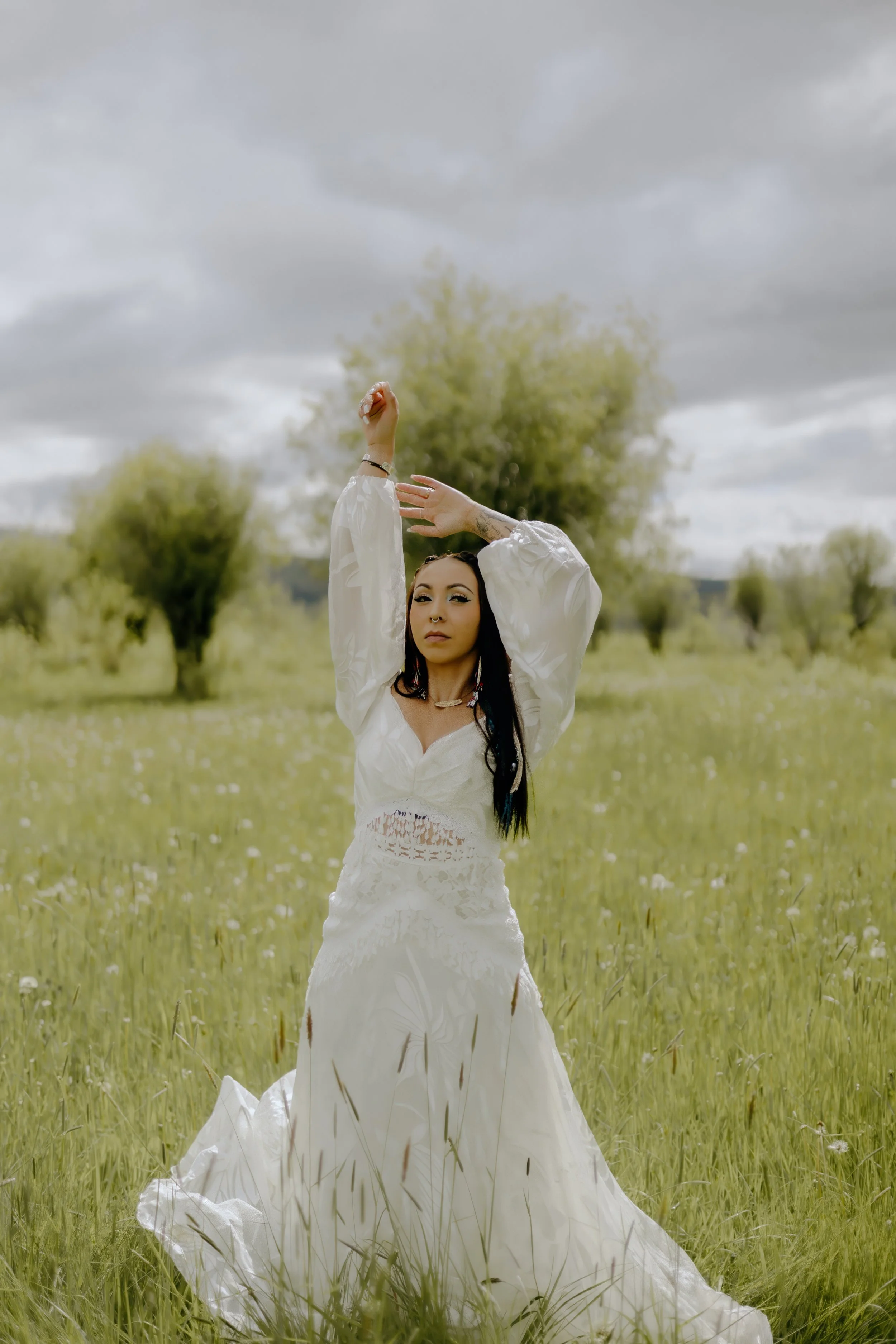 Houston & Texas Wedding & Elopement Photography – Bride raising arm toward sky under open Wyoming skies at Diamond Cross Ranch.